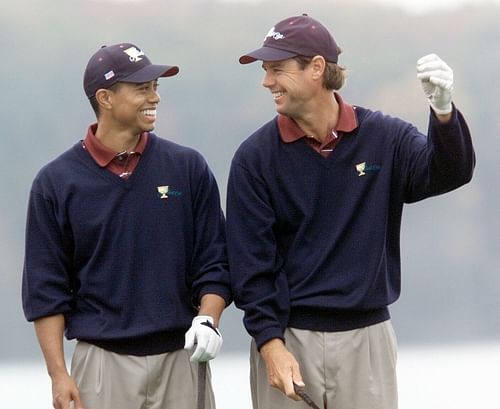 Tiger Woods shares a laugh with Paul Azinger during a practice round at Robert Trent Jones Golf Club - Source: Imagn