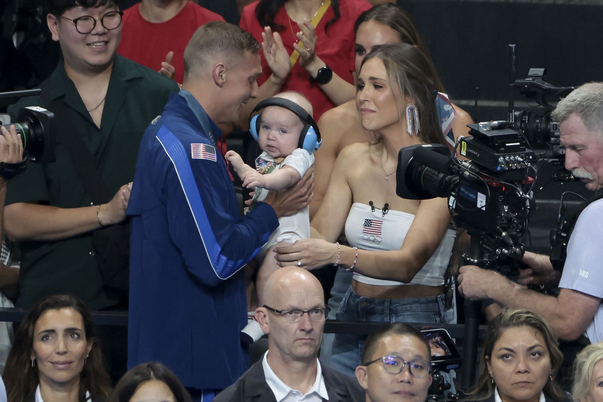 Caeleb Dressel and Meghan Dressel and their baby at Paris Olympics (Photo by Jean Catuffe/Getty Images)