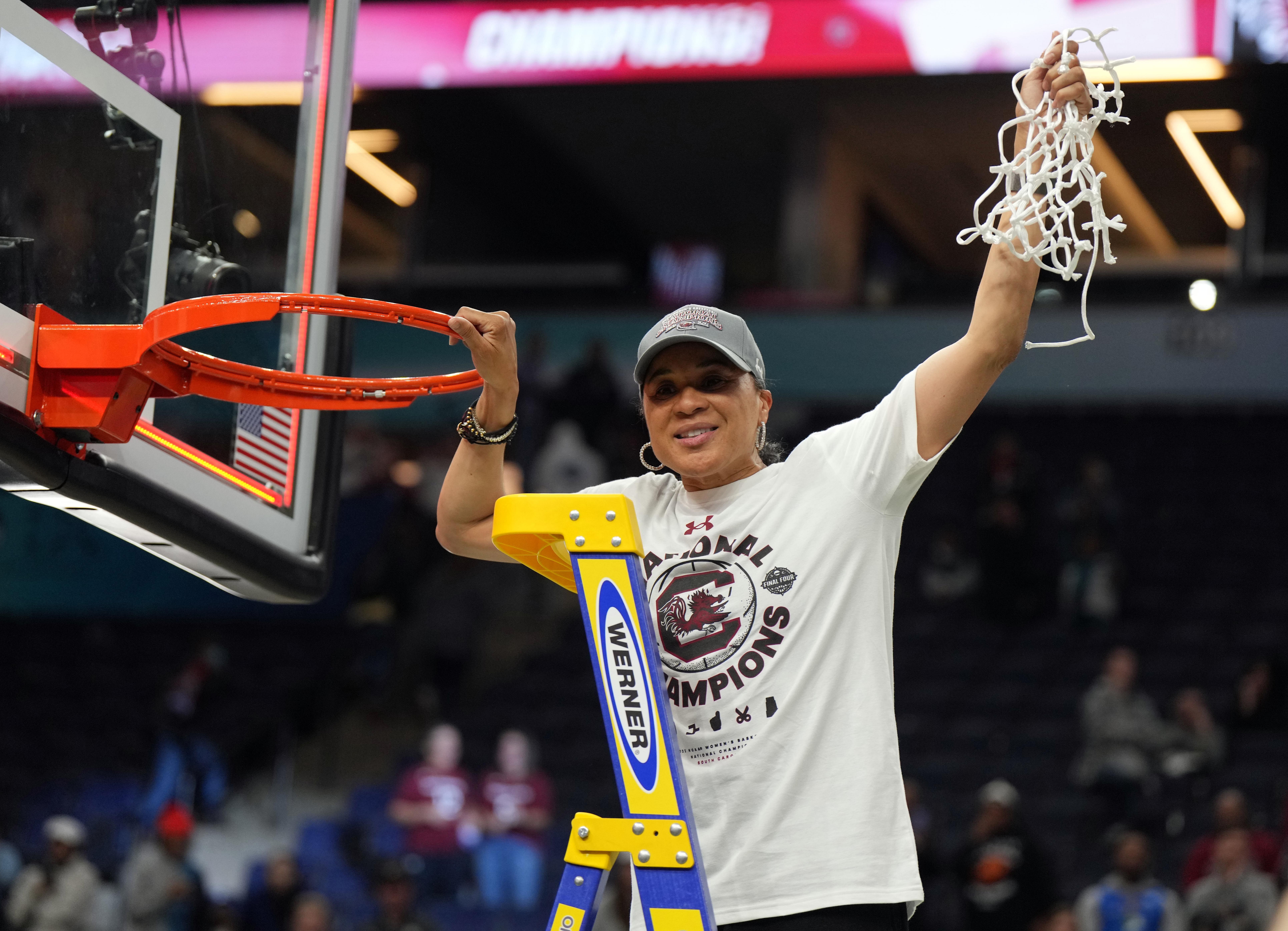 South Carolina Gamecocks head coach Dawn Staley cuts down the net as they celebrate their 64-49 victory over the UConn Huskies in the championship game. Photo: Imagn