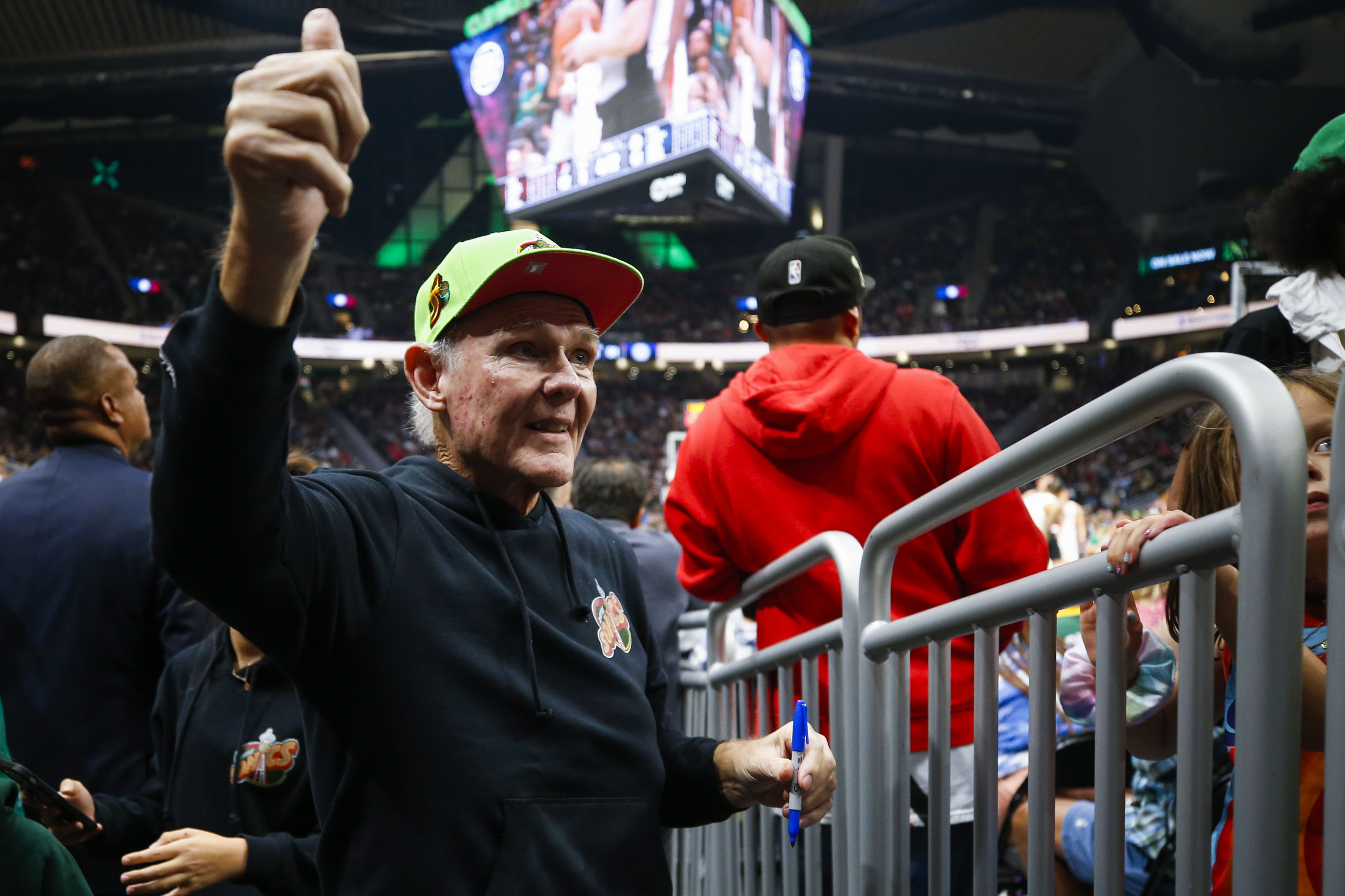 Oct 3, 2022; Seattle, Washington, USA; Former Seattle Supersonics head coach George Karl waves at fans while entering the player tunnel during the third quarter of a preseason game between the Portland Trail Blazers and Los Angeles Clippers at Climate Pledge Arena. Mandatory Credit: Joe Nicholson-Imagn Images - Source: Imagn