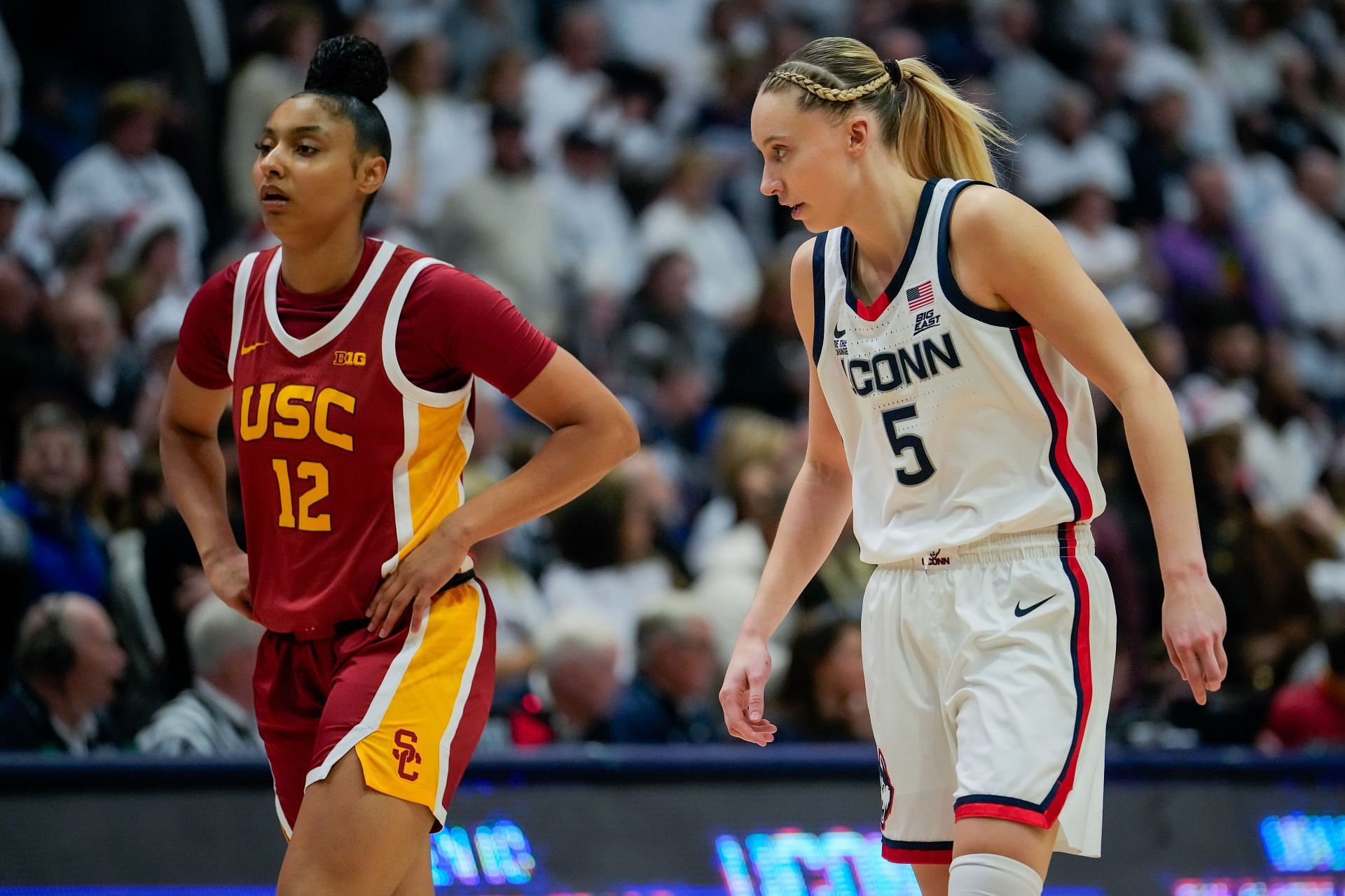 JuJu Watkins (#12) of the USC Trojans and Paige Bueckers (#5) of the Connecticut Huskies play against each other during the first half of their NCAA women&#039;s basketball game. Photo: Getty