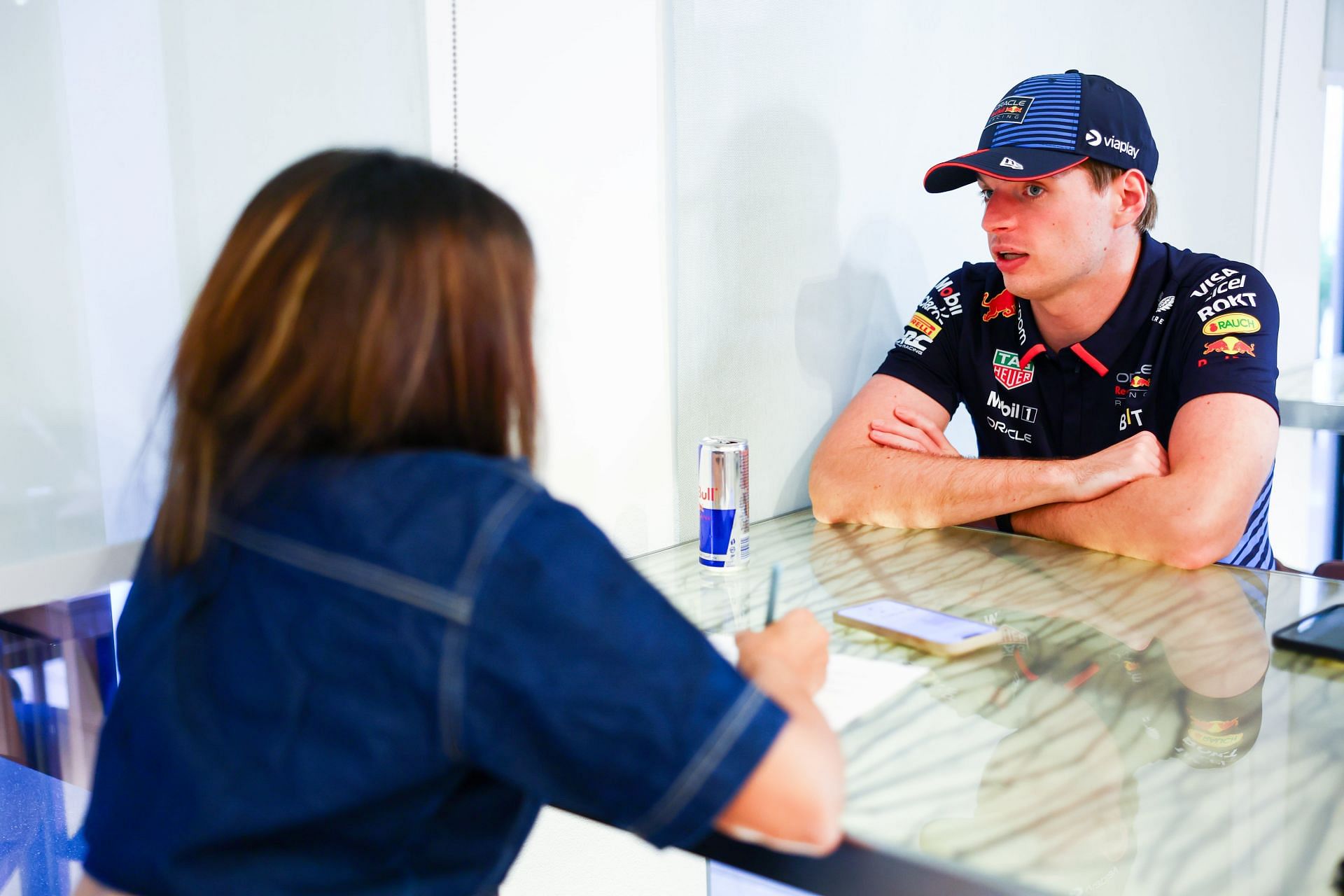 Max Verstappen in conversation with Niharika Ghorpade from Sportskeeda ahead of the 2024 Abu Dhabi GP. (Images by Mark Thompson/ Getty Images)