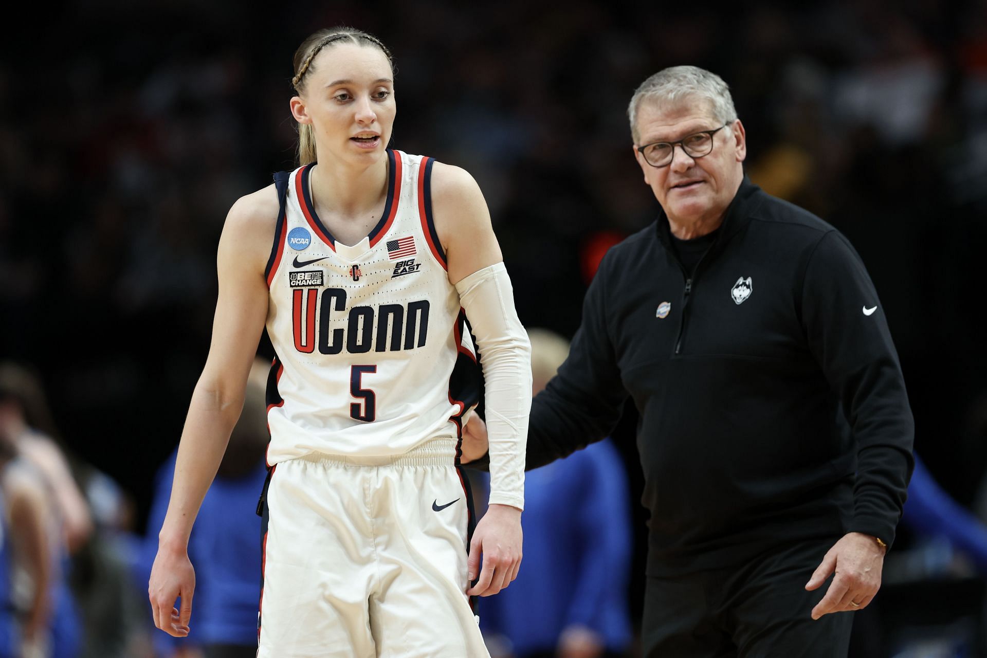 Paige Bueckers (#5) talks to head coach Geno Auriemma of the Connecticut Huskies during the first half of their Sweet 16 game against the Duke Blue Devils on March 30, 2024, in Portland, Oregon. Photo: Getty