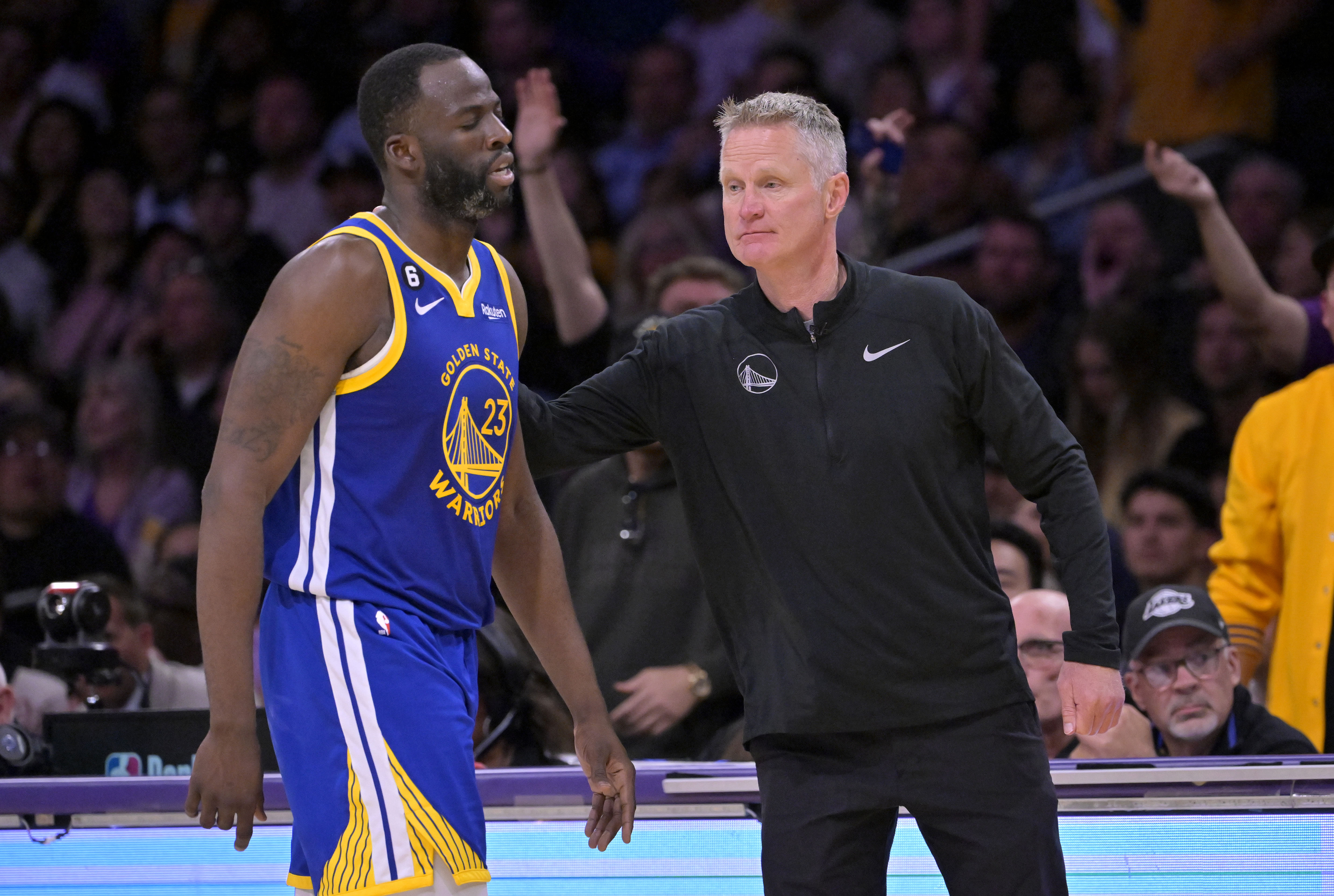 Golden State Warriors forward Draymond Green walks past head coach Steve Kerr after fouling out at Crypto.com Arena. Photo Credit: Imagn