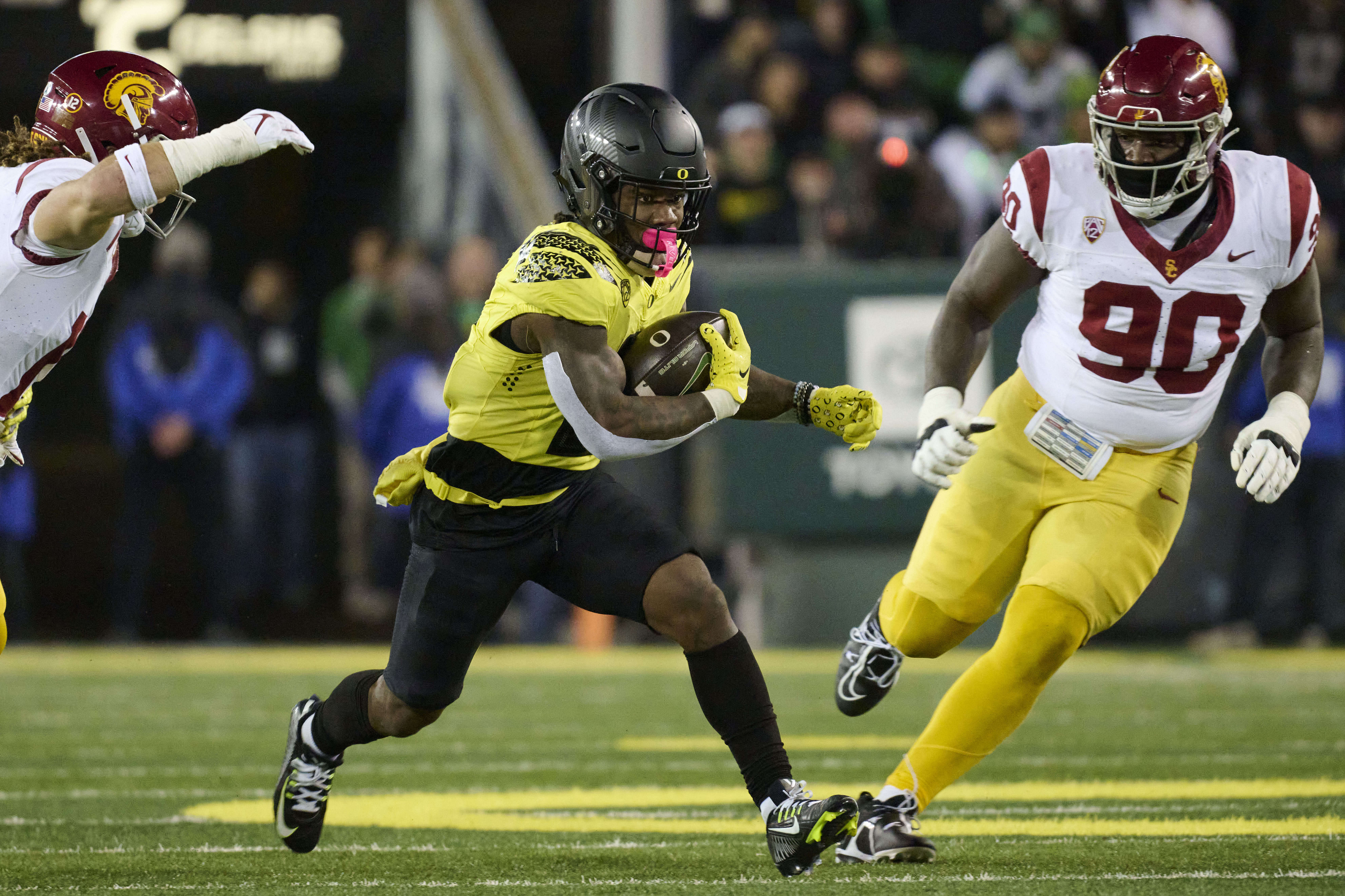 Bear Alexander could go from playing against the Oregon Ducks, as shown, to playing for the Ducks. (Photo Credit: IMAGN)