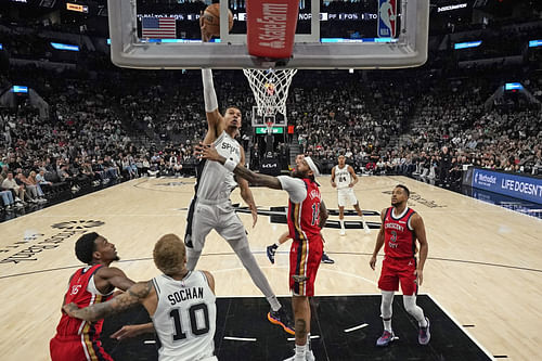 Spurs' Victor Wembanyama dunks against Brandon Ingram (Image via Imagn)