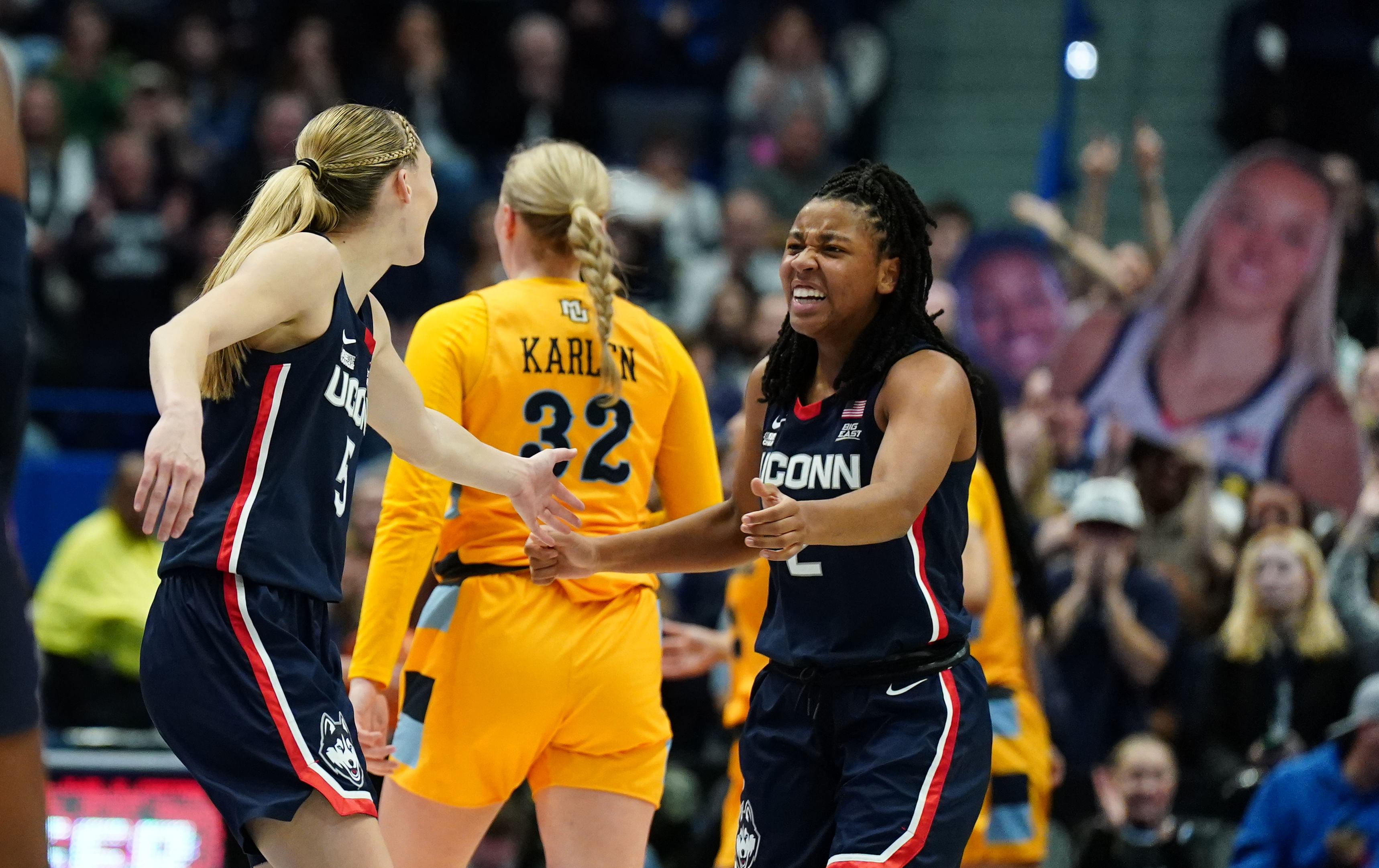 UConn Huskies guard KK Arnold (#2) and guard Paige Bueckers (#5) reacts after a play against the Marquette Golden Eagles in the first half at XL Center. Photo: Imagn