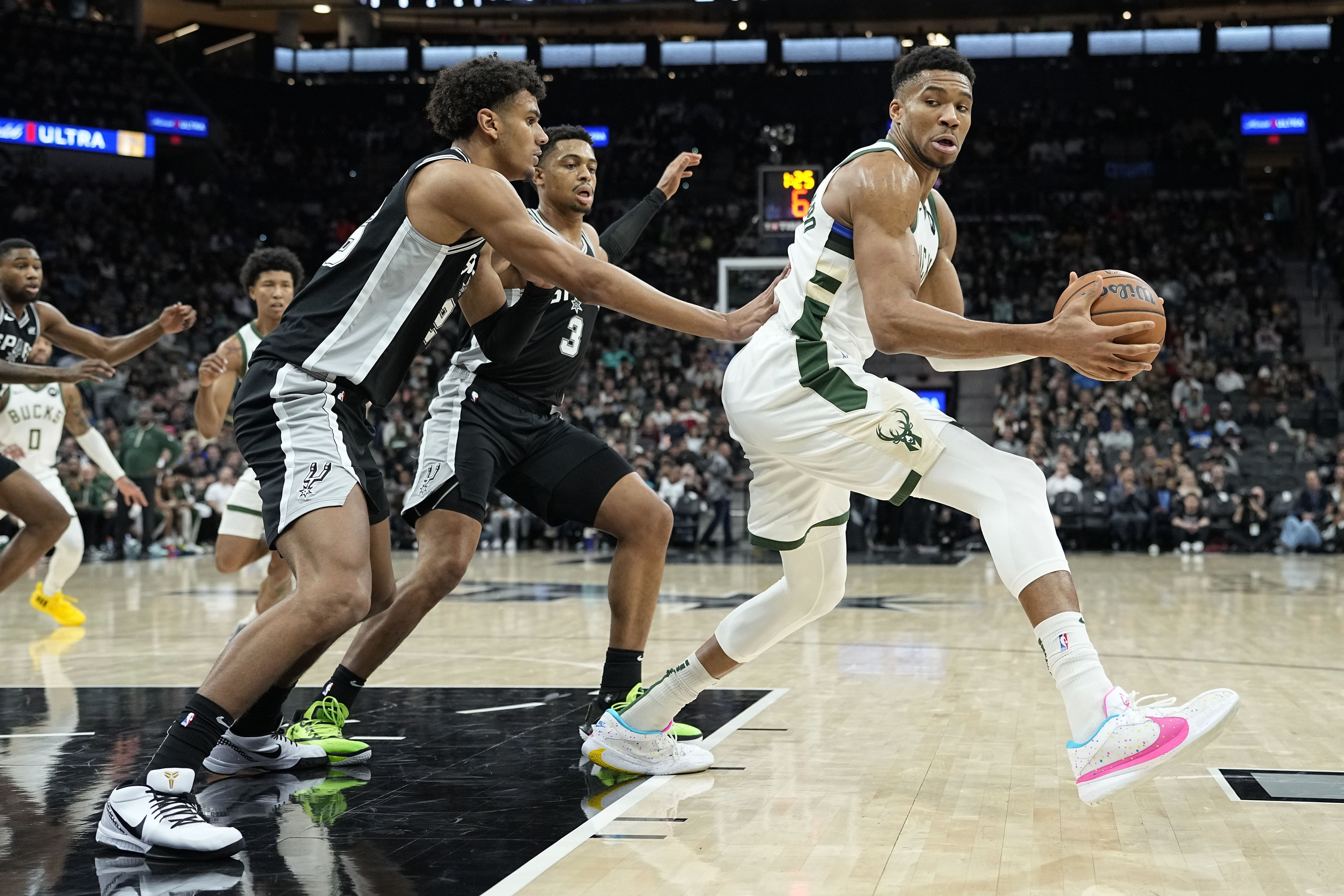 Milwaukee Bucks forward Giannis Antetokounmpo defended by San Antonio Spurs forward Dom Barlow at Frost Bank Center (Credits: IMAGN)