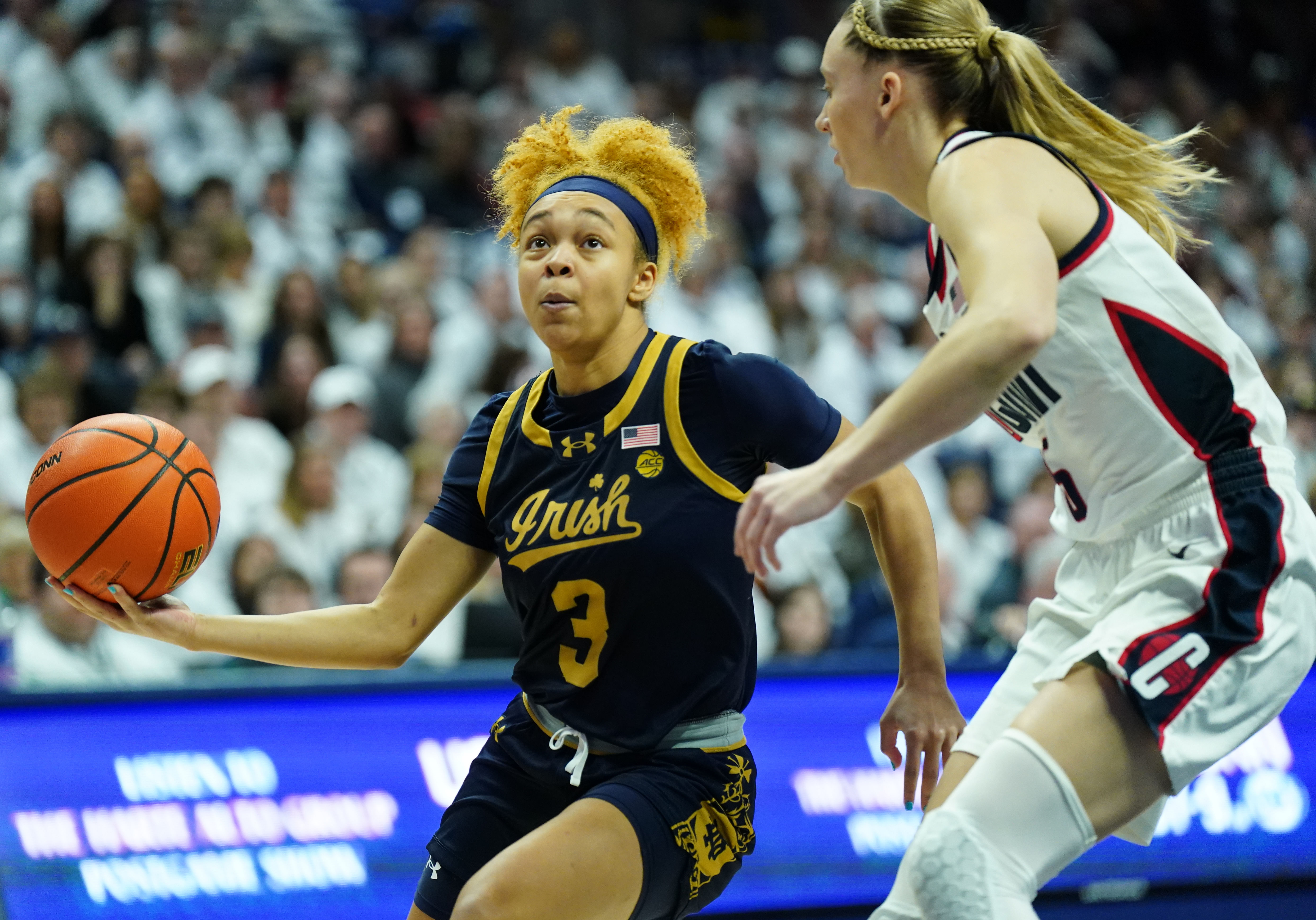 Notre Dame Fighting Irish guard Hannah Hidalgo (#3) drives the ball against UConn Huskies guard Paige Bueckers (5) in the first half at Harry A. Gampel Pavilion on Jan. 27, 2024. Photo: Imagn