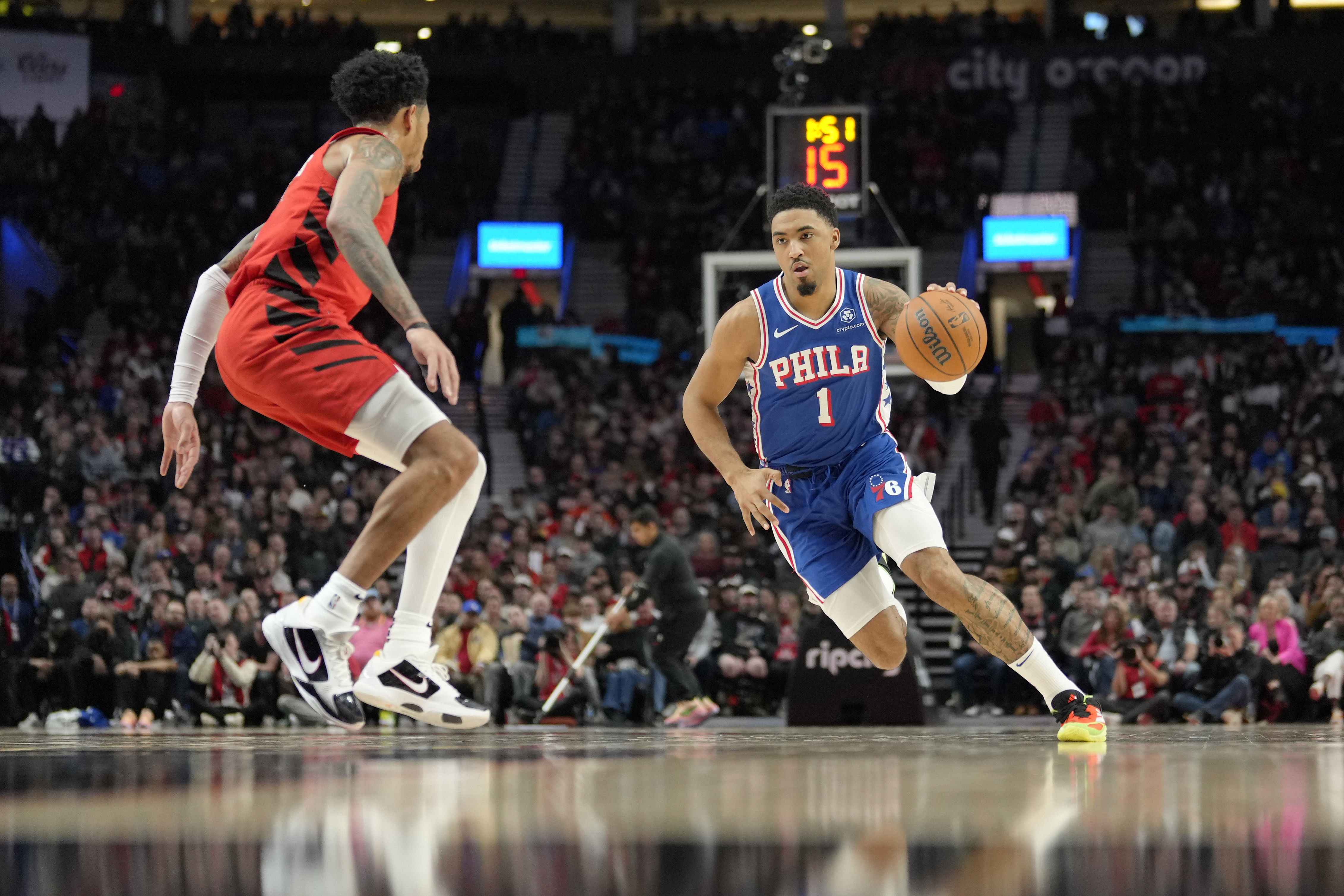 Philadelphia 76ers forward KJ Martin dribbles the ball while defended by Portland Trail Blazers shooting guard Anfernee Simons at Moda Center. Photo Credit: Imagn