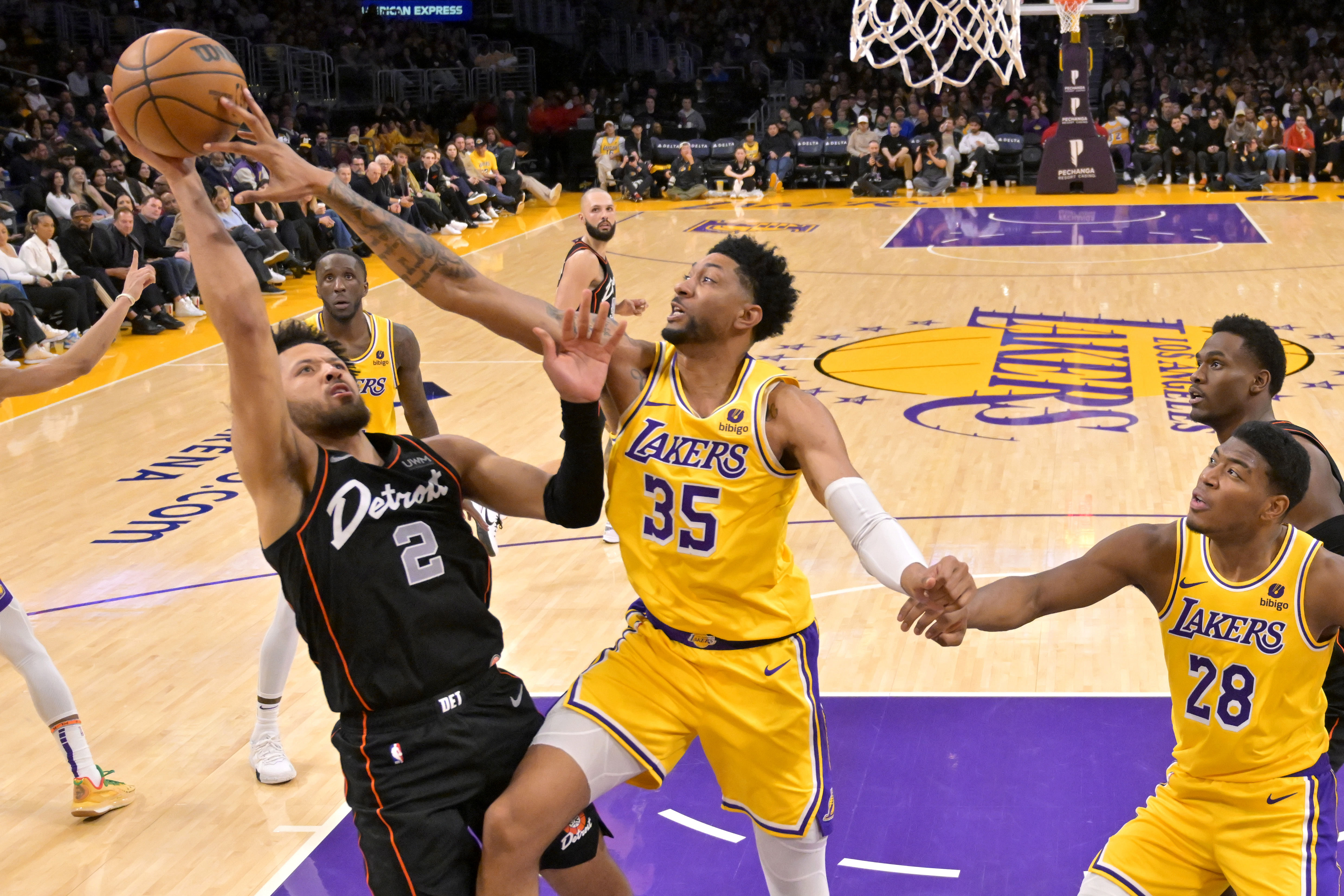 Feb 13, 2024; Los Angeles, California, USA; Los Angeles Lakers forward Christian Wood (35) blocks a shot by Detroit Pistons guard Cade Cunningham (2) in the second half at Crypto.com Arena. Mandatory Credit: Jayne Kamin-Oncea-Imagn Images - Source: Imagn