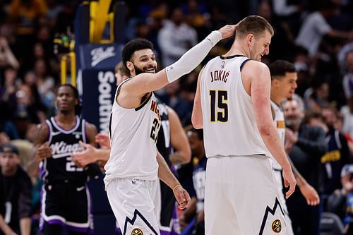 Denver Nuggets guard Jamal Murray reacts with center Nikola Jokic against the Sacramento Kings at Ball Arena. Mandatory Credit: Imagn