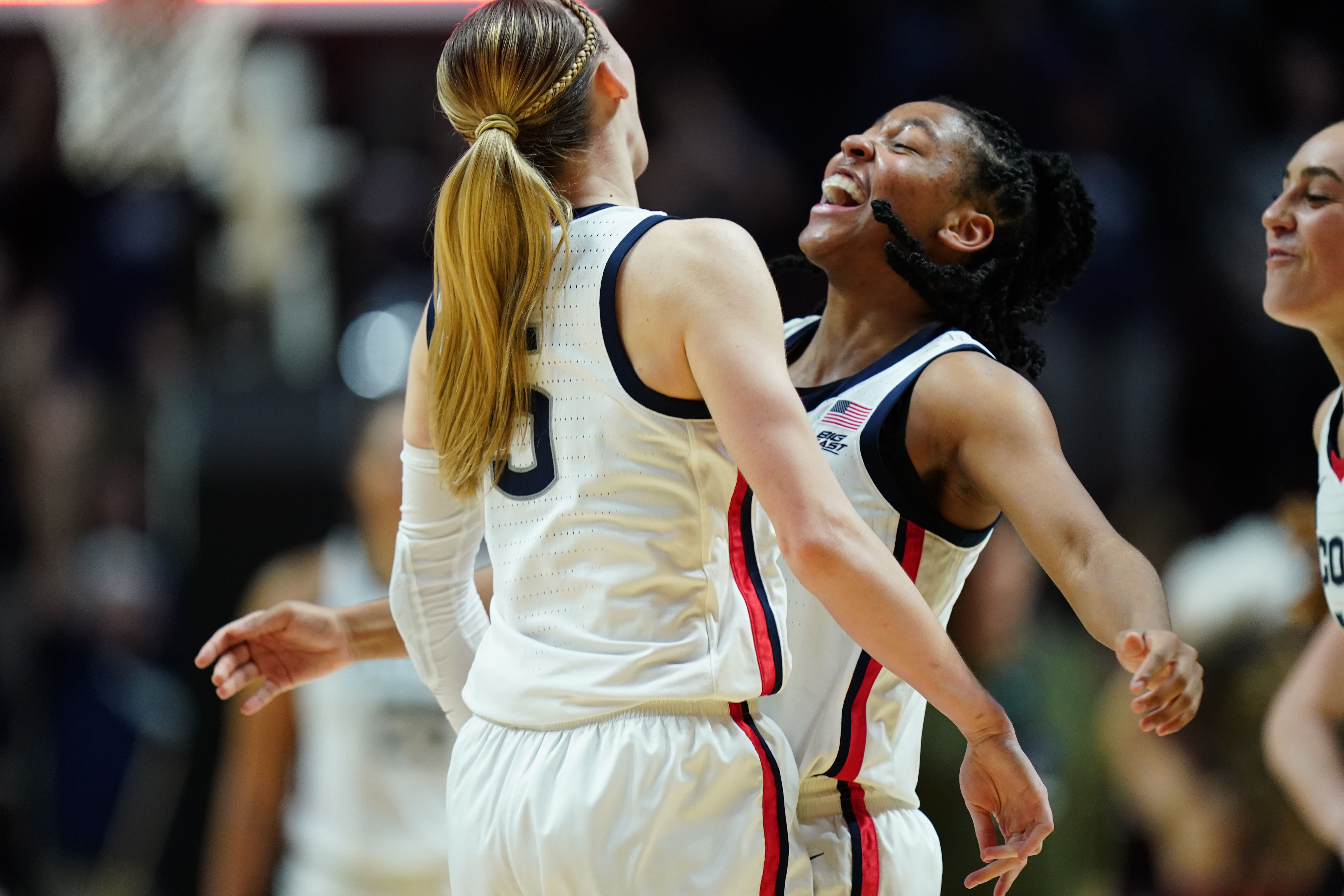 UConn Huskies guard Paige Bueckers (#5) reacts with guard KK Arnold (2) after her three-point basket against the Marquette Golden Eagles in the second half at Mohegan Sun Arena. Photo: Imagn