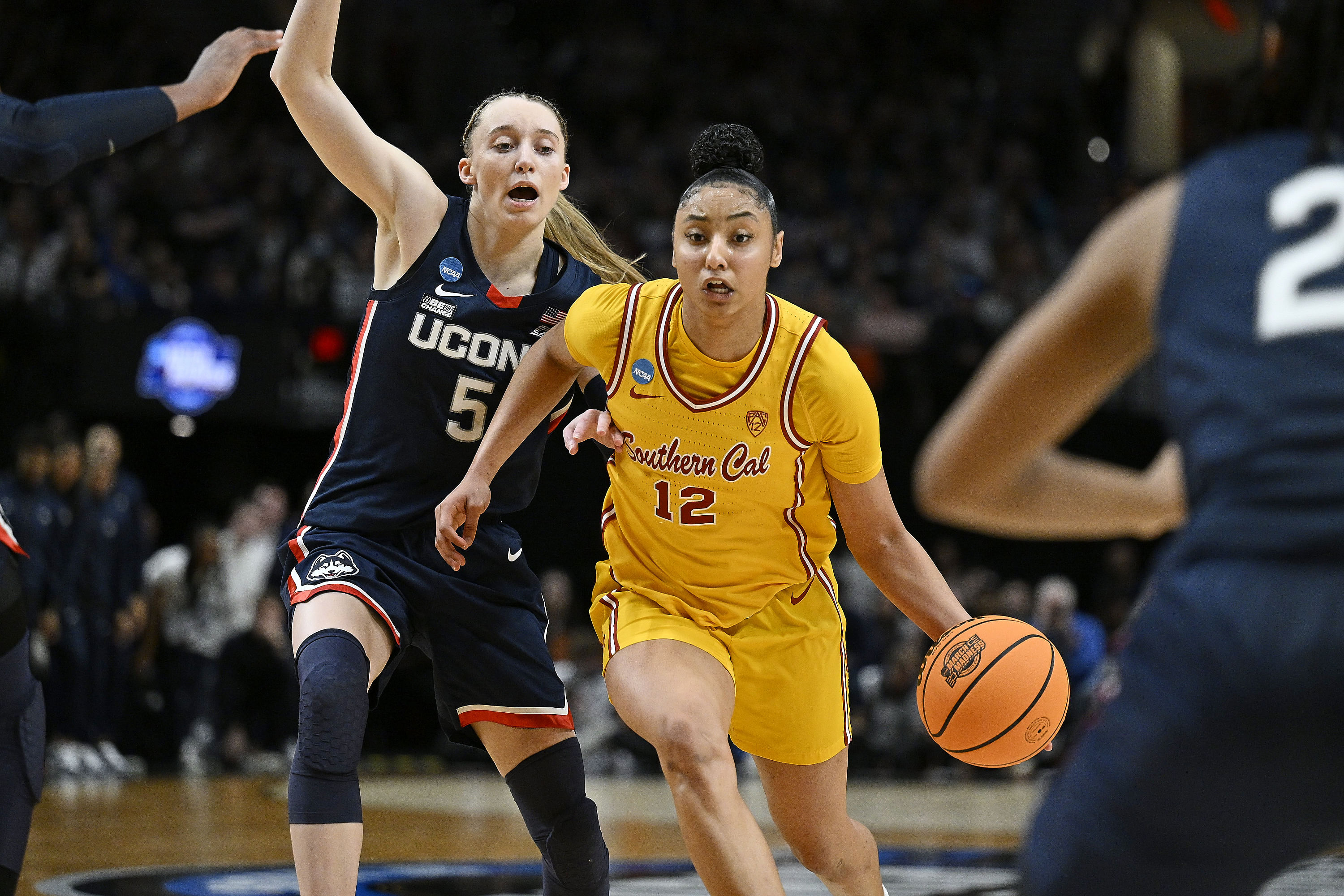 USC Trojans guard JuJu Watkins (#12) drives to the basket during the second half against UConn Huskies guard Paige Bueckers (5) in the finals of the Portland Regional of the NCAA Tournament. Photo: Imagn