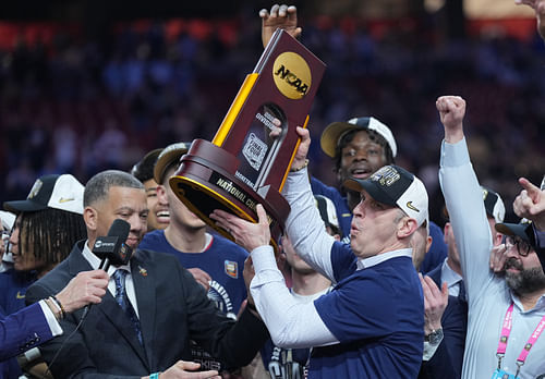 UConn Huskies head coach Dan Hurley hoists the championship trophy after defeating the Purdue Boilermakers in the national championship game at State Farm Stadium. Photo: Imagn