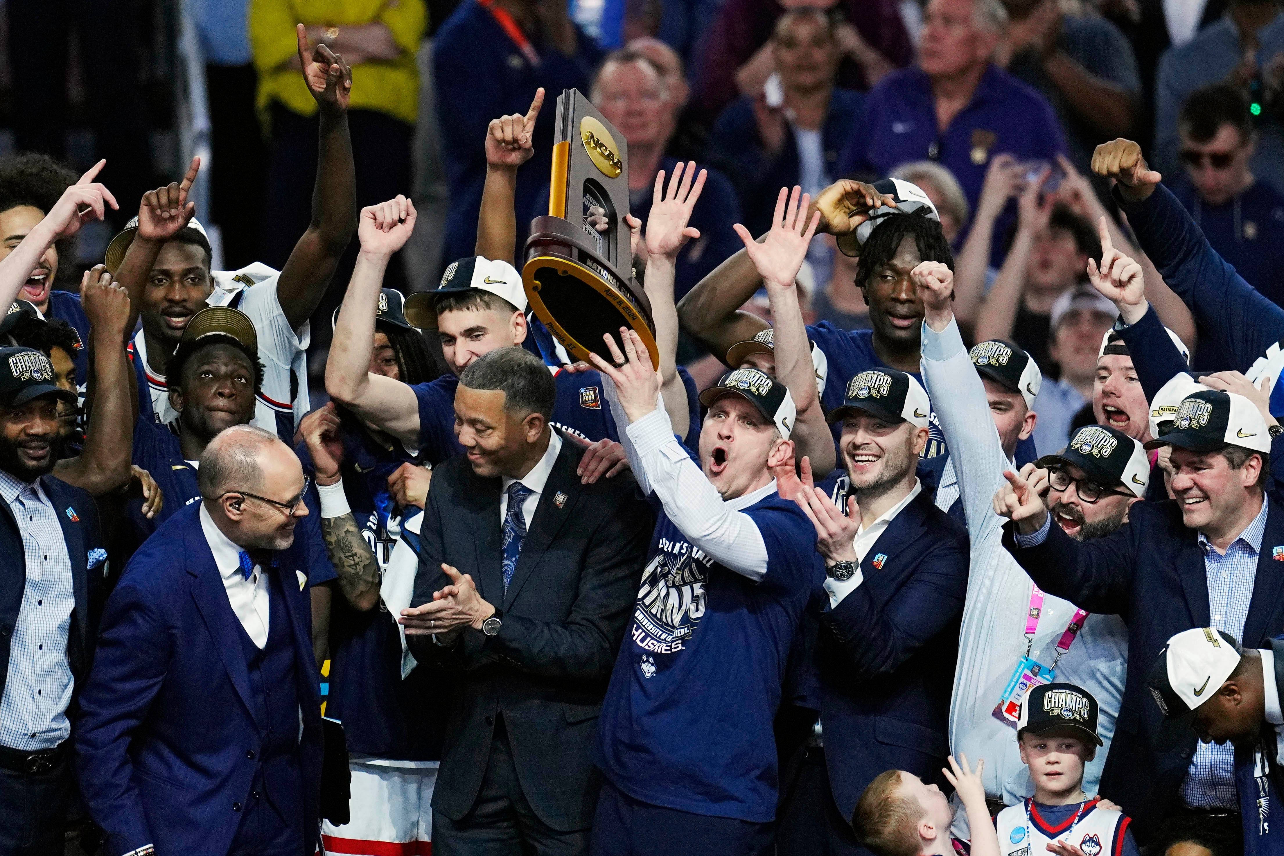 UConn Huskies coach Dan Hurley celebrates with the trophy after defeating the Purdue Boilermakers in the 2024 national championship game, Photo: Imagn