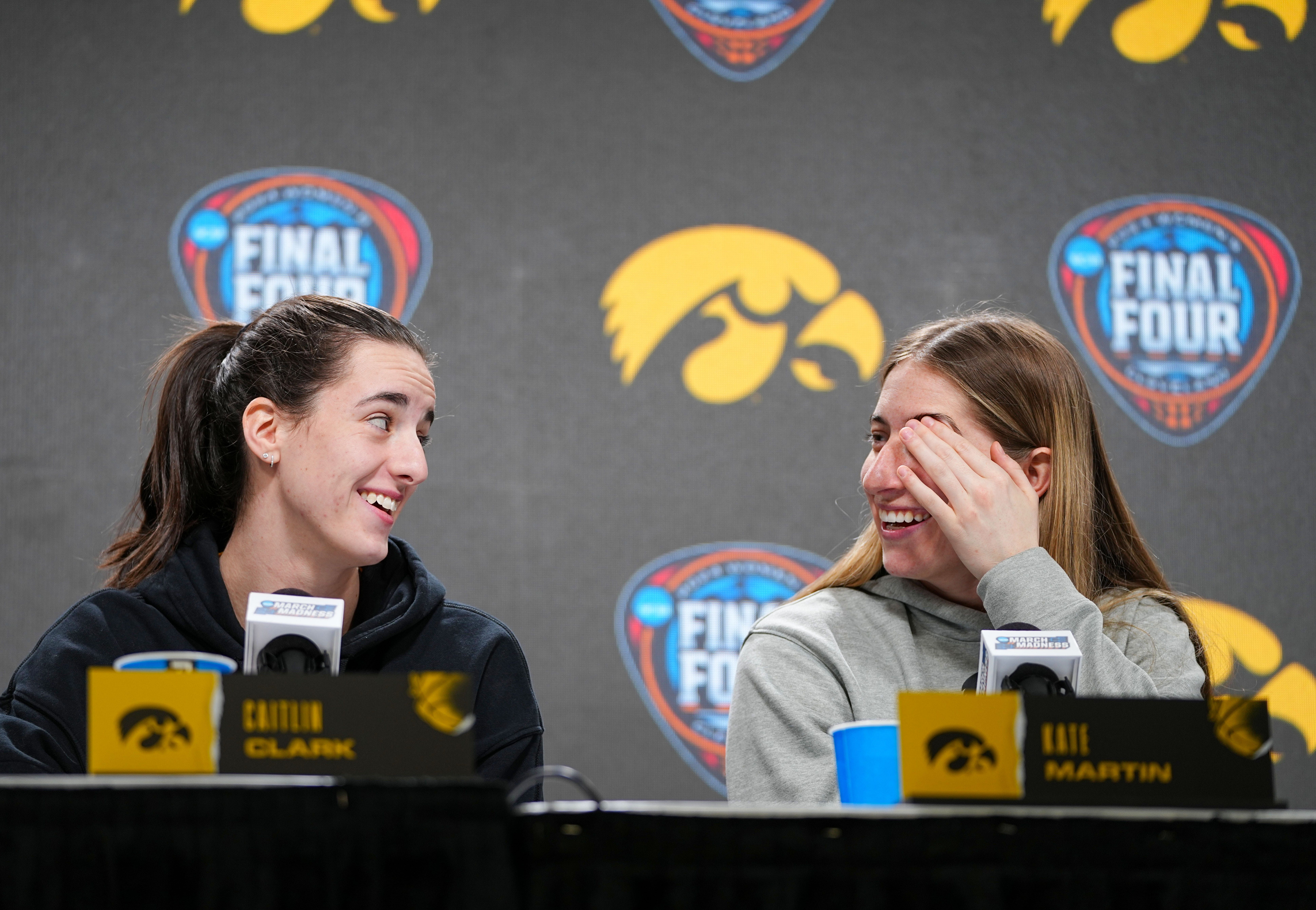 Iowa Hawkeyes guard Caitlin Clark (22) and Iowa Hawkeyes guard Kate Martin (20) take questions at Rocket Mortgage Arena, Thursday, April 4, 2024 in Cleveland. - Source: Imagn