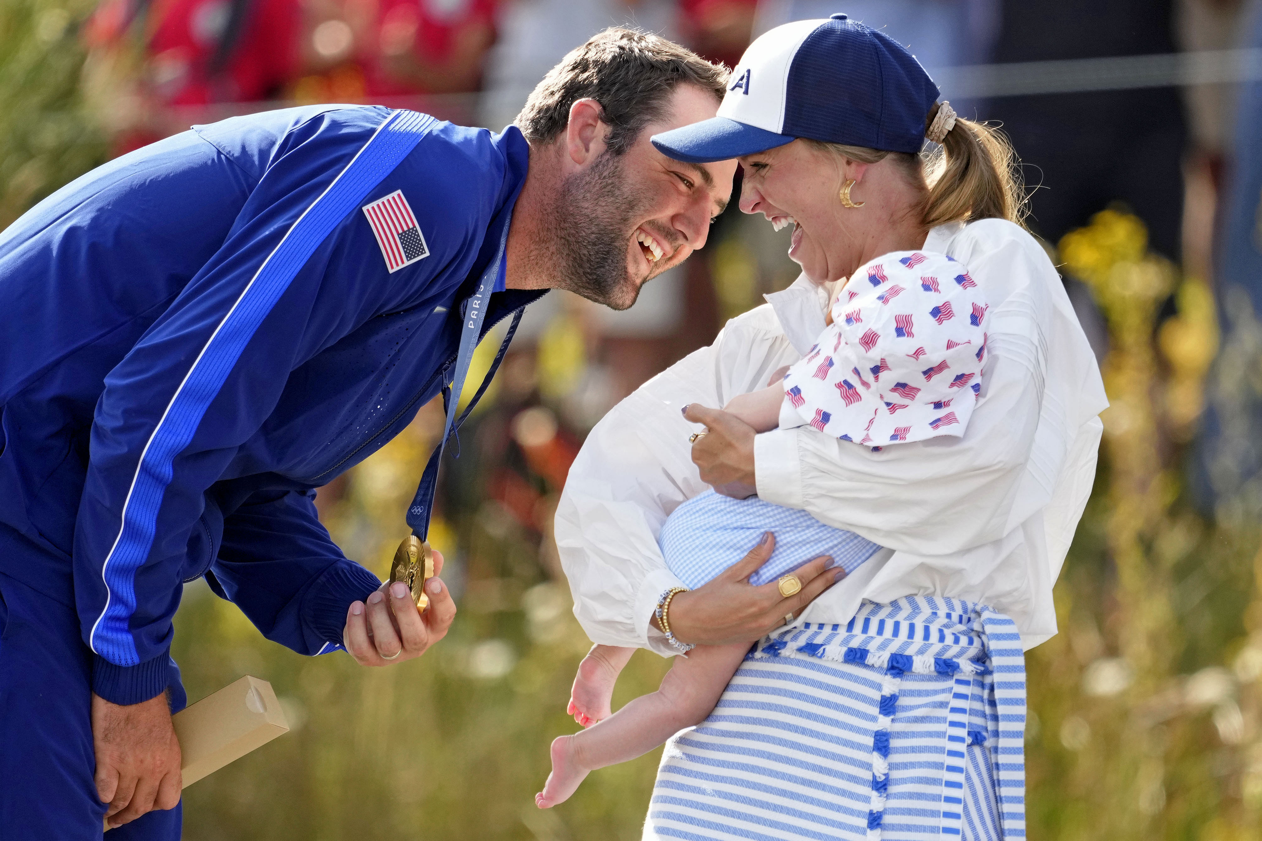 Scottie Scheffler celebrating his Paris Olympics win with wife and son (Image Source: Imagn)