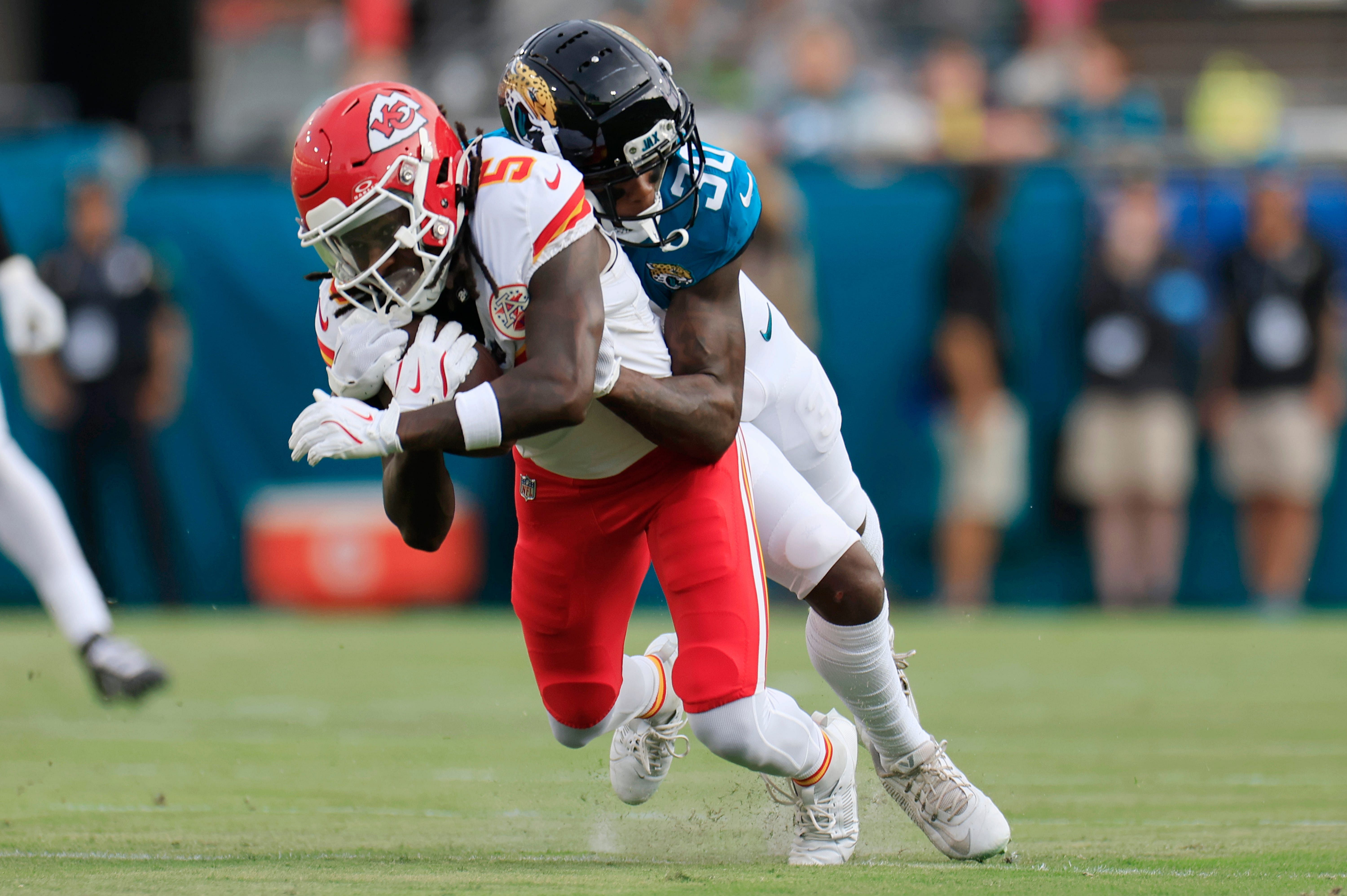 Hollywood Brown gets tackled by Jacksonville Jaguars defender - Source: Imagn