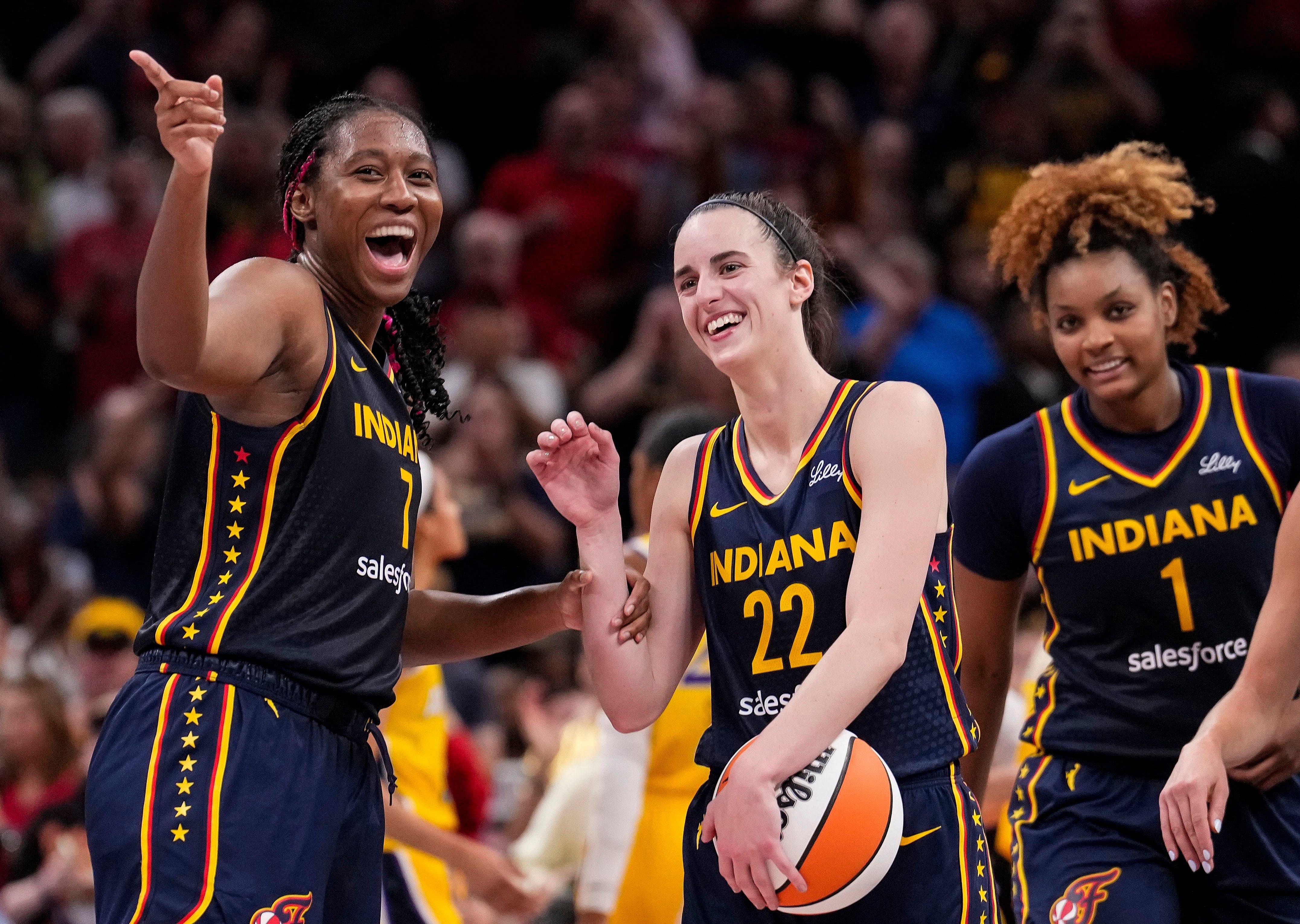 Indiana Fever forward Aliyah Boston celebrates with guard Caitlin Clark during a game at Gainbridge Fieldhouse in Indianapolis. Photo Credit Imagn