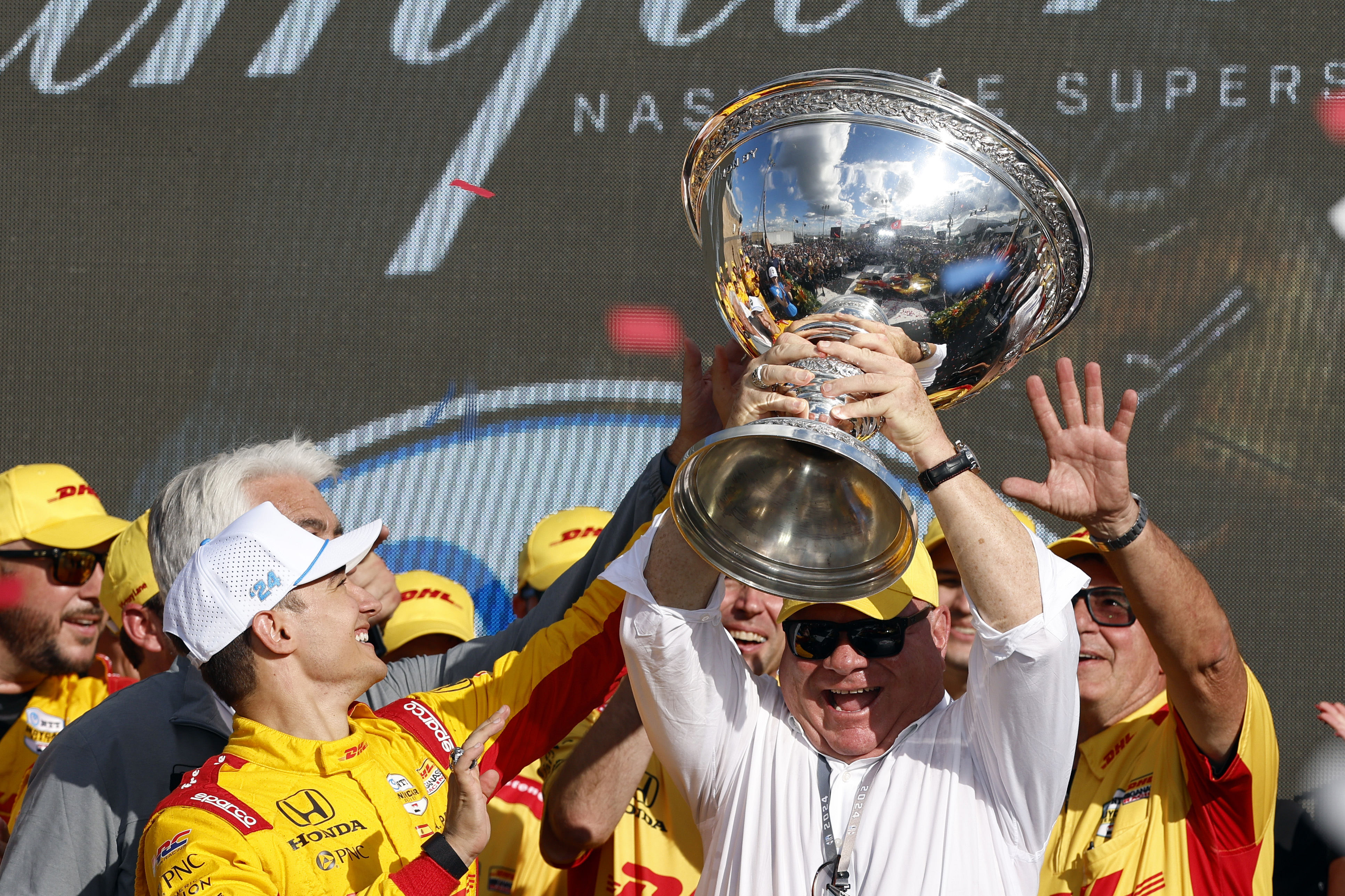 Driver &Aacute;lex Palou and Chip Ganassi (R) after winning the series championship - Source: Imagn