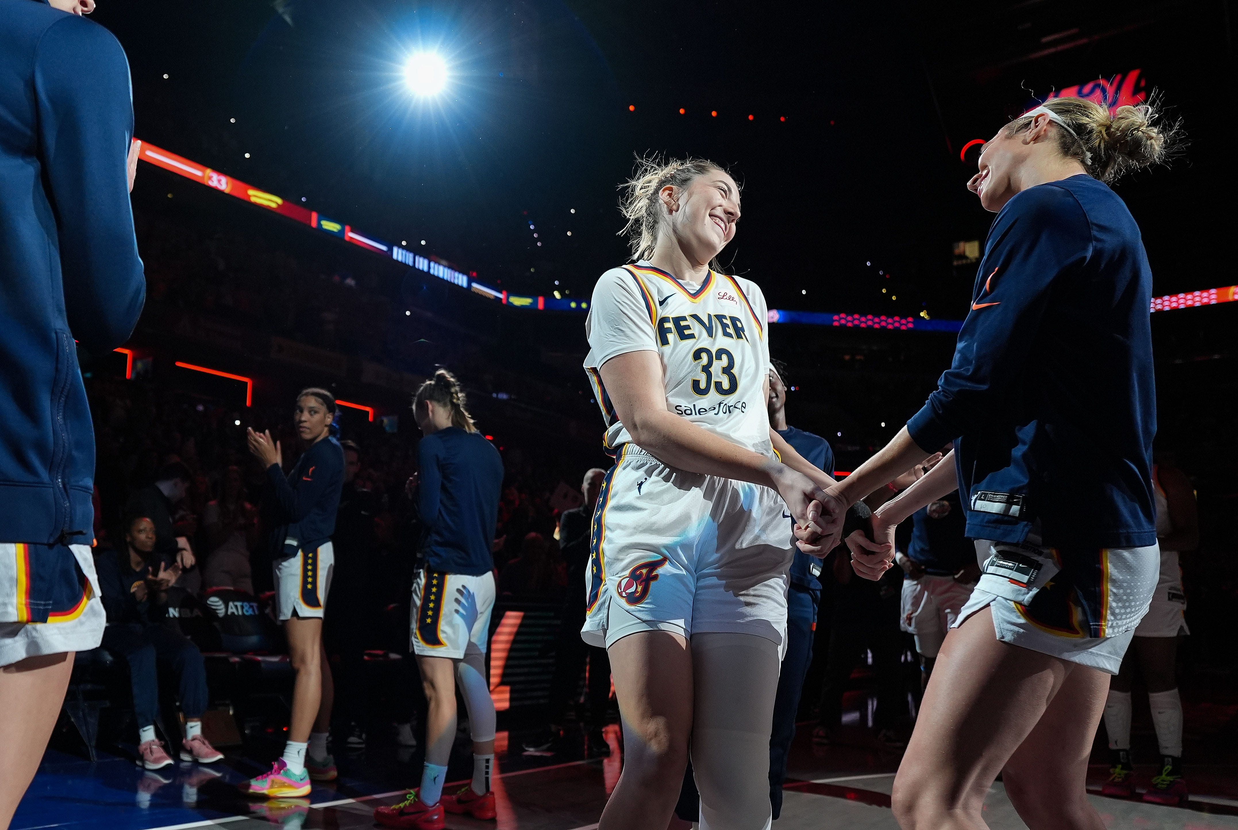 Indiana Fever forward Katie Lou Samuelson (33) shakes hands with Indiana Fever guard Lexie Hull (10) during team intorductions on Friday, July 12, 2024, during the game at Gainbridge Fieldhouse in Indianapolis. The Indiana Fever defeated the Phoenix Mercury, 95-86. - Source: Imagn