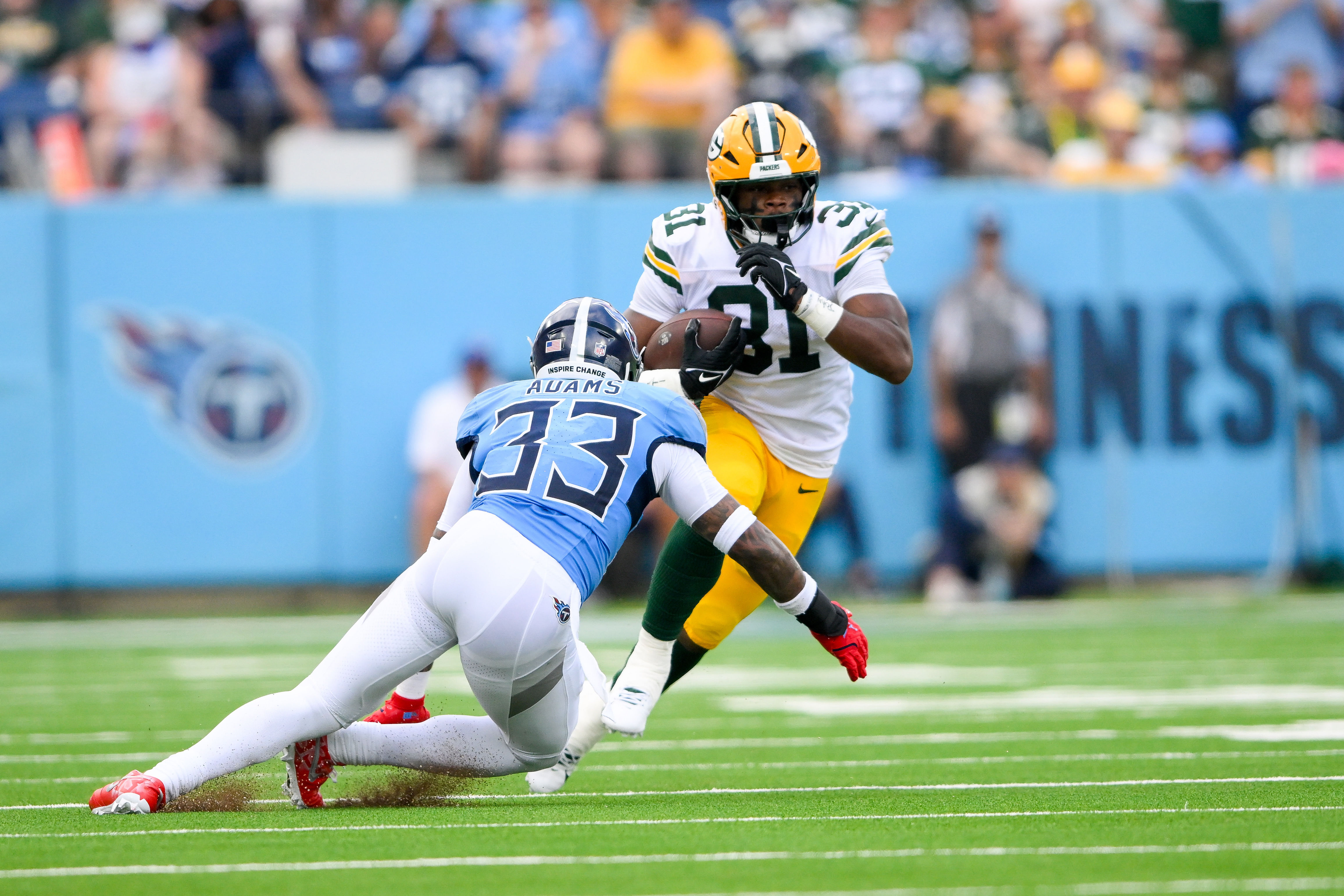 Former Tennessee Titans safety Jamal Adams (33) tackles a Green Bay Packers running back (Credits: IMAGN)