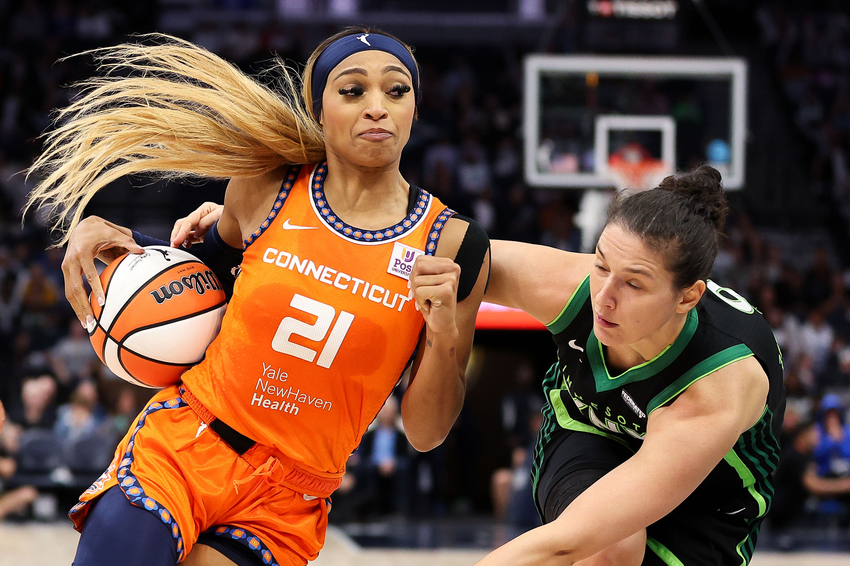 Connecticut Sun guard DiJonai Carrington works around Minnesota Lynx forward Cecilia Zandalasini during the 2024 WNBA Semi-finals at Target Center. Photo Credit: Imagn