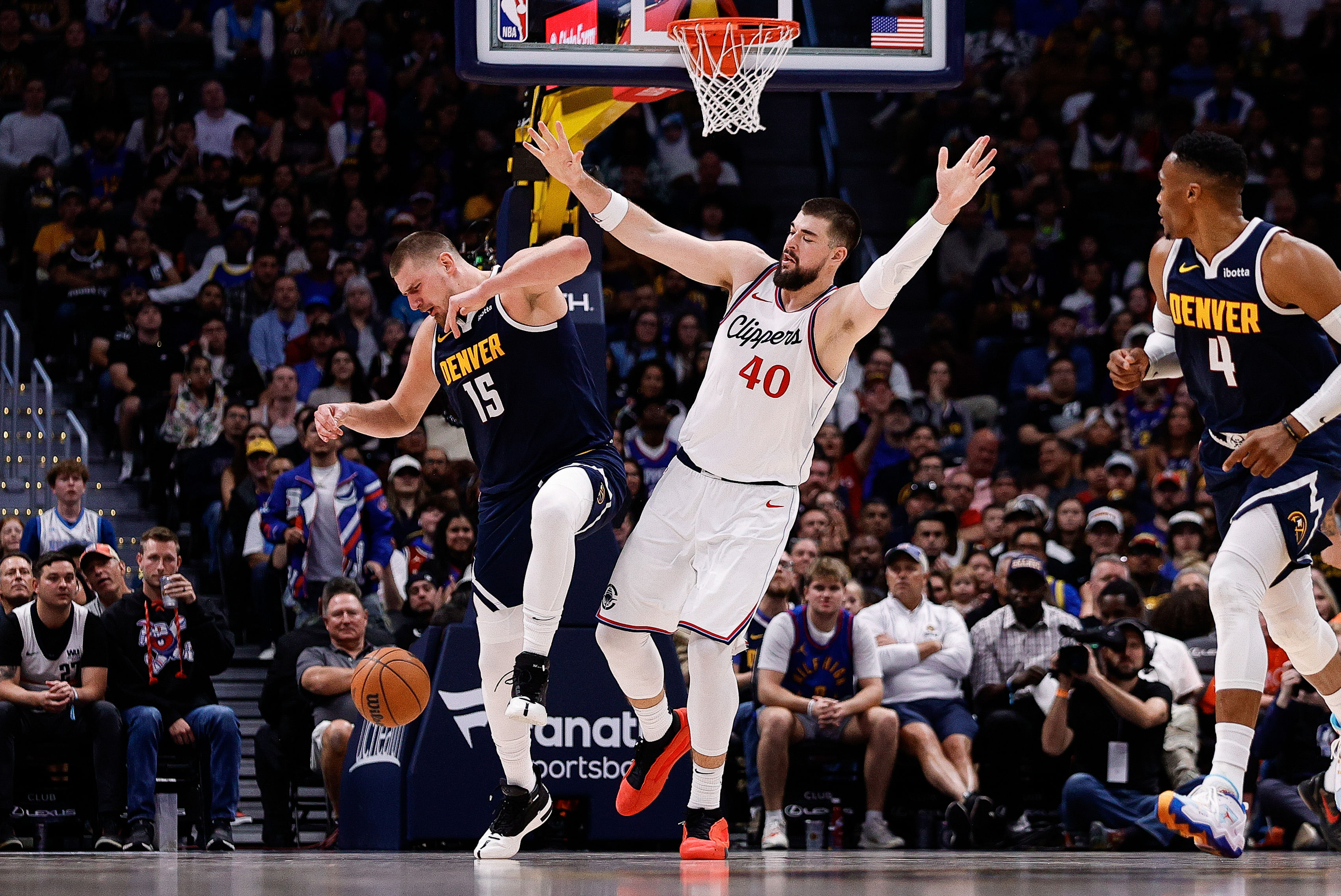 LA Clippers center Ivica Zubac collides with Denver Nuggets center Nikola Jokic at Ball Arena. Photo Credit: Imagn