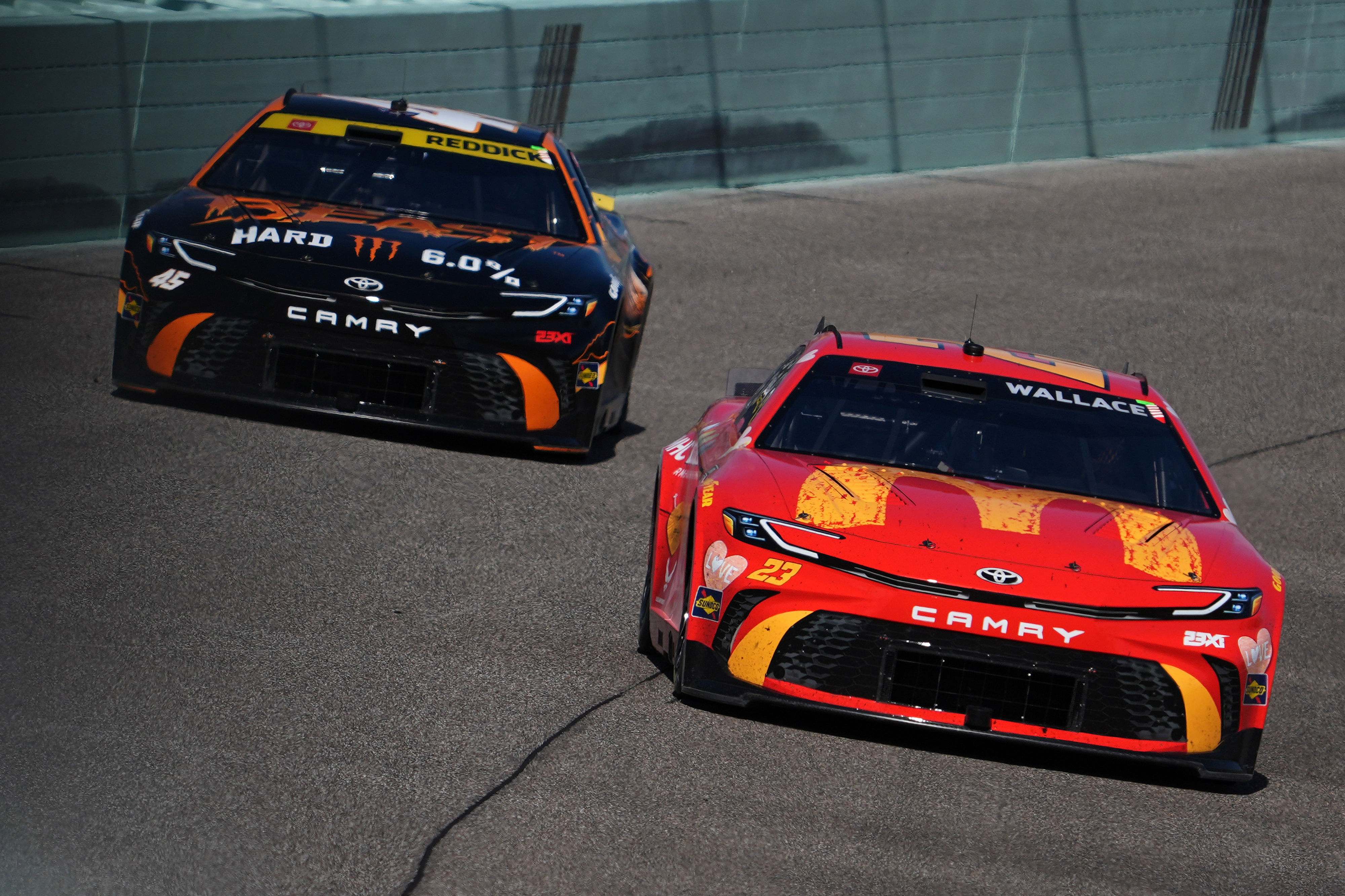 23XI Racing driver Bubba Wallace (23) leads teammate Tyler Reddick (45) during the Straight Talk Wireless 400 at Homestead-Miami Speedway. - Source: Imagn