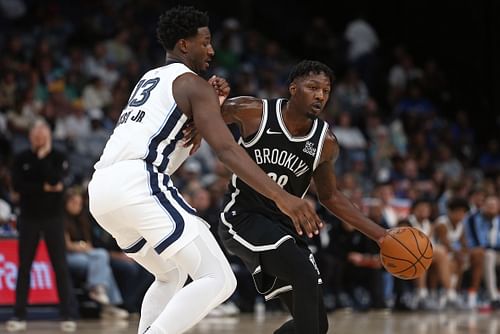 Brooklyn Nets forward Dorian Finney-Smith dribbles as Memphis Grizzlies forward Jaren Jackson Jr. defends at FedExForum. (Photo Credit: Imagn)