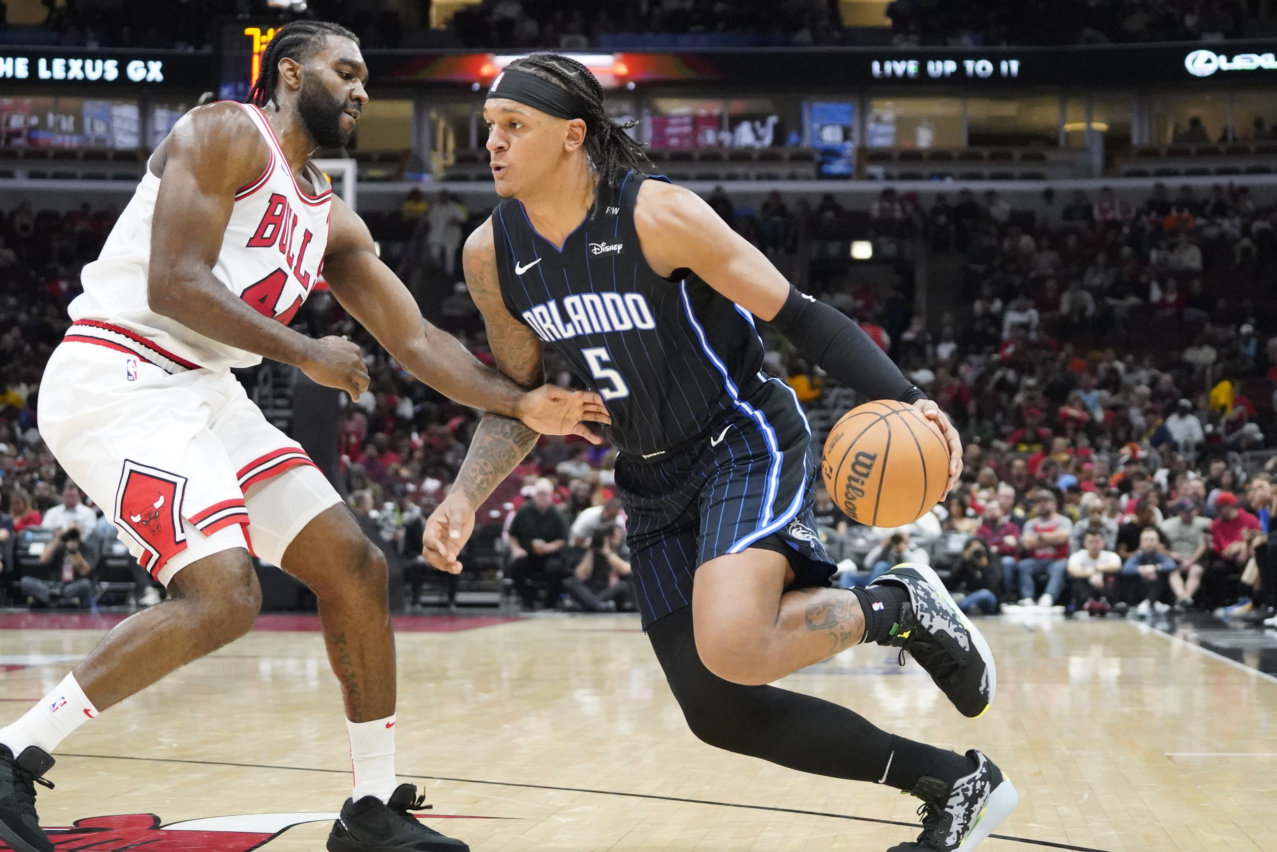 Chicago Bulls forward Patrick Williams defends Orlando Magic forward Paolo Banchero at United Center. Photo Credit: Imagn