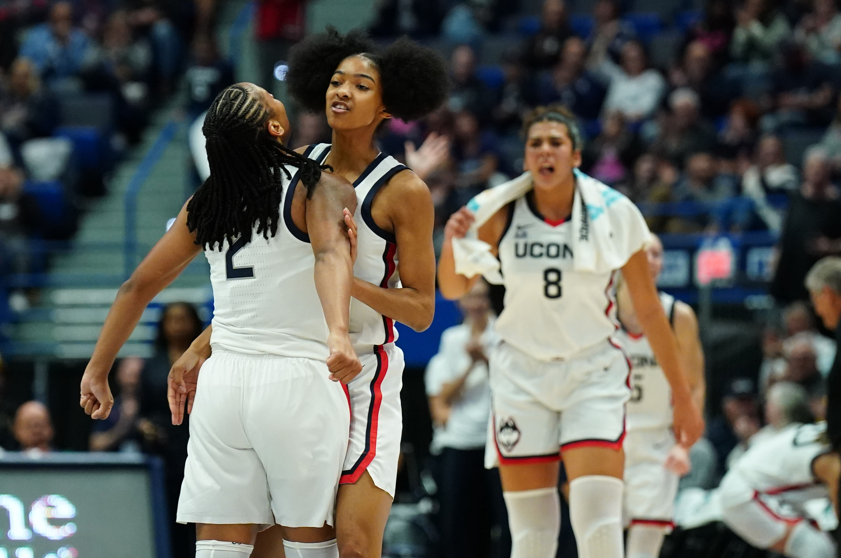 UConn Huskies guard Qadence Samuels (10) and KK Arnold (2) celebrate after a play against the Boston University Terriers in the first half of their NCAA game. Photo: Imagn