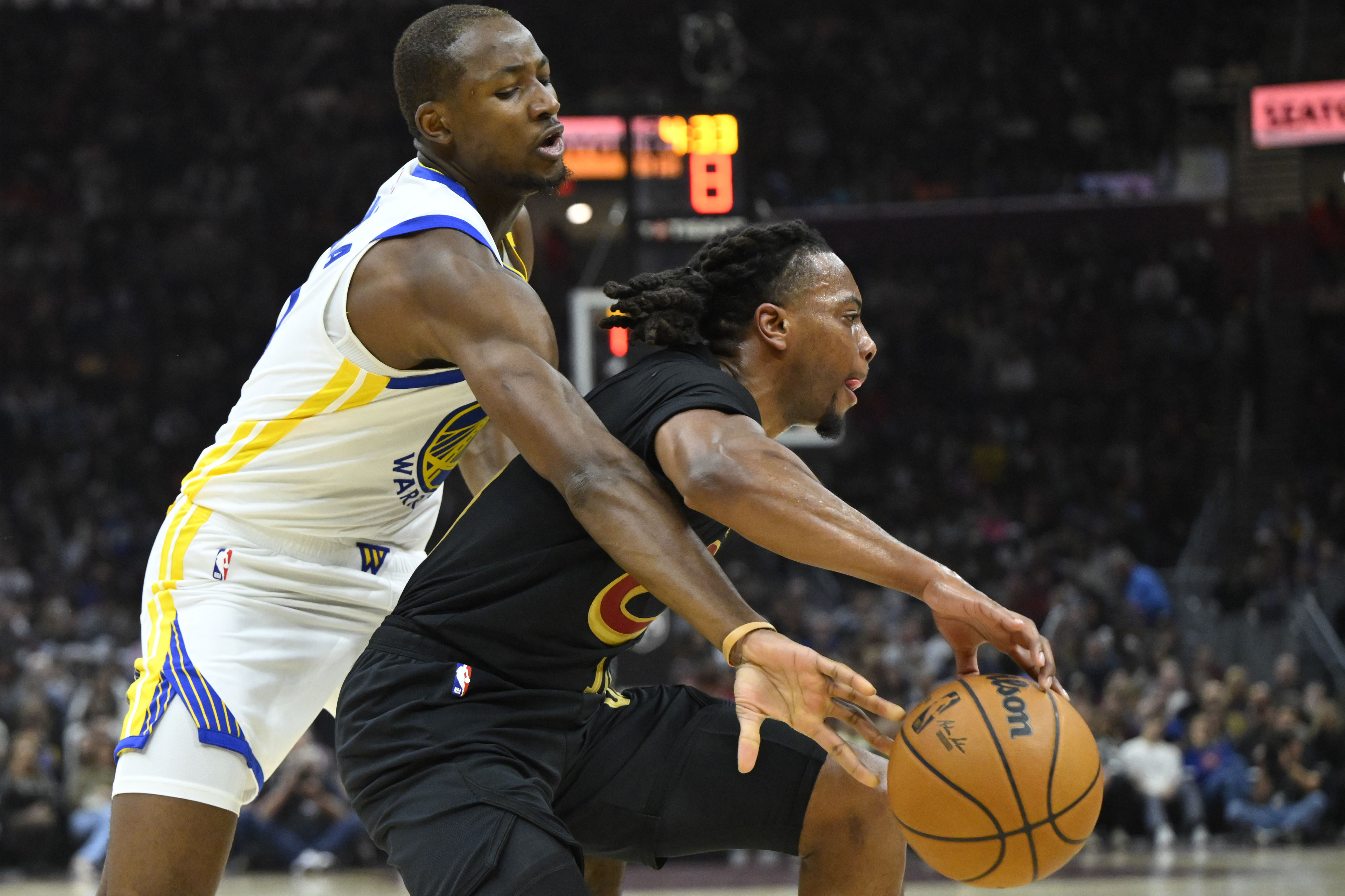 Golden State Warriors forward Jonathan Kuminga defends Cleveland Cavaliers guard Darius Garland at Rocket Mortgage FieldHouse. Photo Credit: Imagn