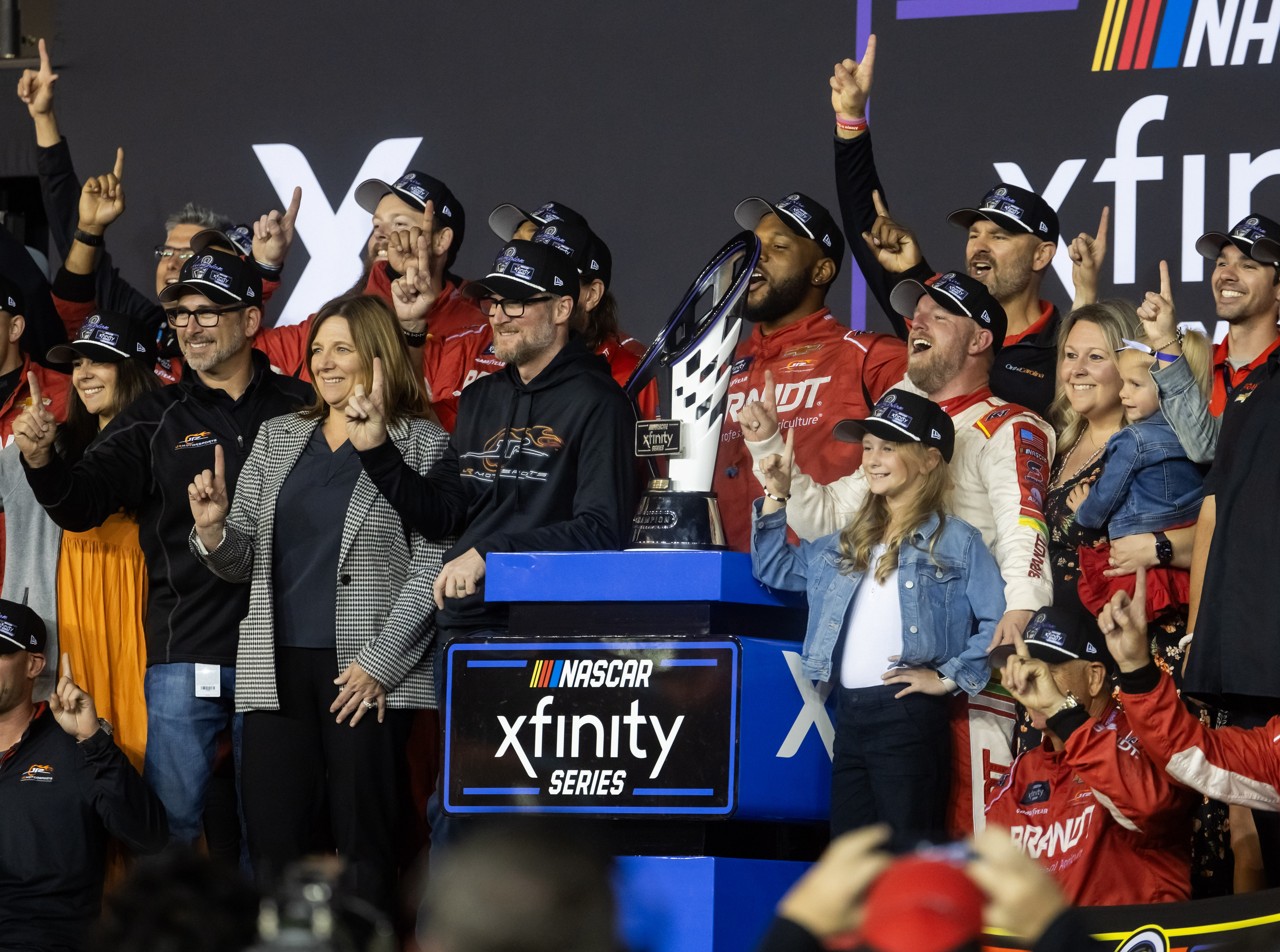 Dale Earnhardt Jr. and sister Kelley Earnhardt Miller celebrate with driver Justin Allgaier after winning the 2024 Xfinity Series championship - Source: Imagn