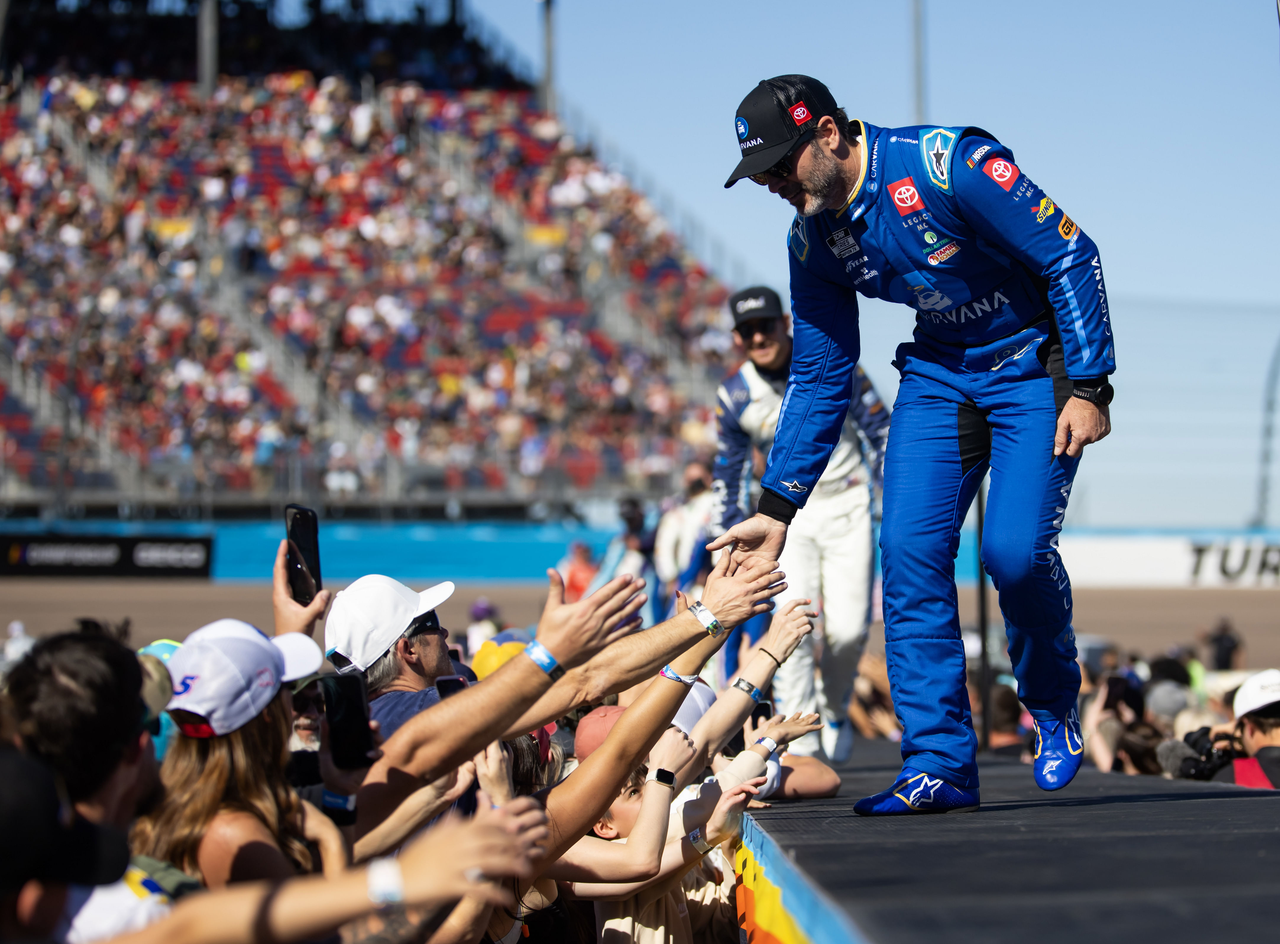  Jimmie Johnson greets fans before the NASCAR Cup Series Championship race at Phoenix Raceway.  - Source: Imagn