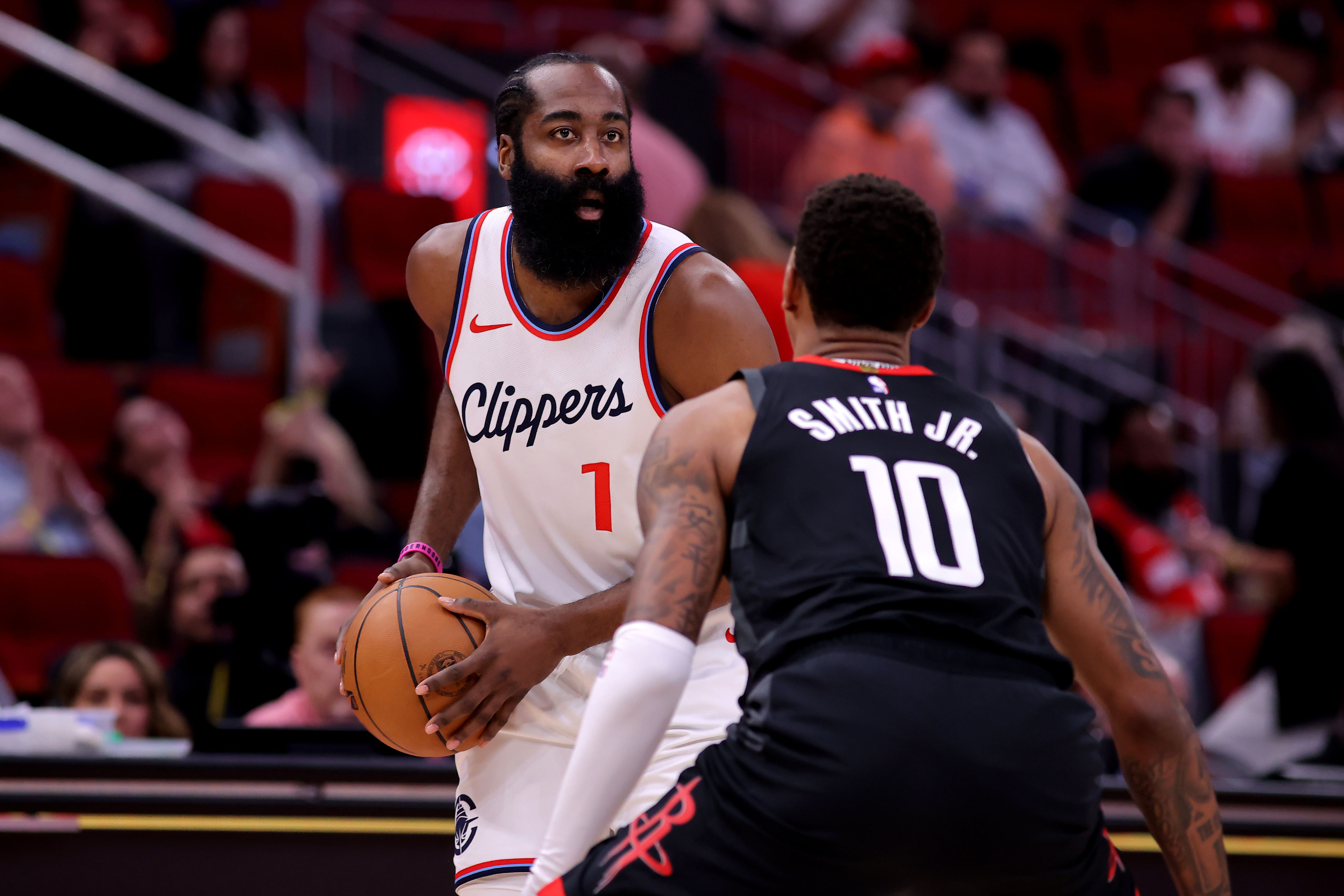 LA Clippers guard James Harden handles the ball against Houston Rockets forward Jabari Smith Jr at Toyota Center. Photo Credit: Imagn