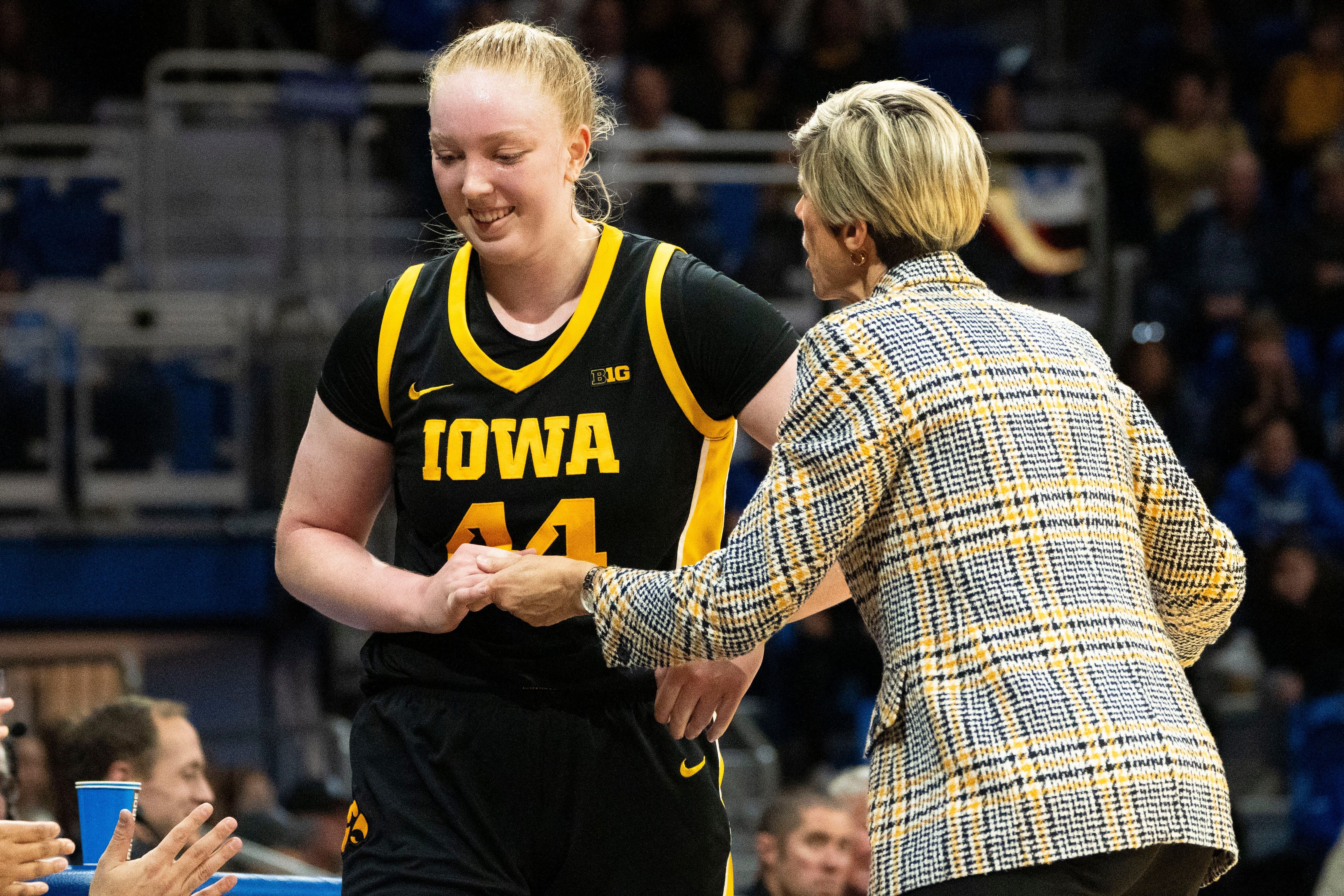 Iowa head coach Jan Jensen talks with forward Addison O'Grady (44) as she walks to the bench during the game against Drake at Knapp Center in Des Moines. Photo: Imagn