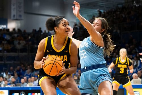 Iowa forward Hannah Stuelke (45) looks to attempt a shot against Drake guard Brooklin Dailey (22) during their NCAA basketball game at Knapp Center on Sunday, Nov. 17, 2024. Photo: Imagn