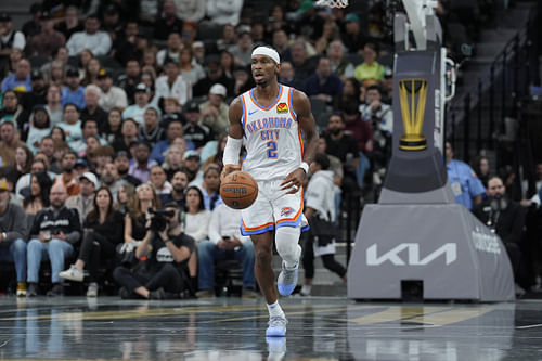 Oklahoma City Thunder guard Shai Gilgeous-Alexander brings the ball up the court against the San Antonio Spurs at Frost Bank Center. Photo Credit: Imagn