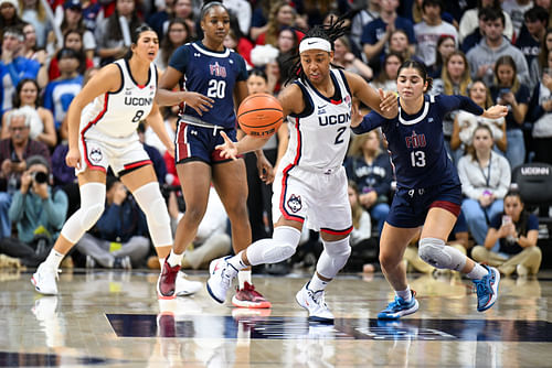 UConn Huskies guard KK Arnold (2) steals the ball from Fairleigh Dickinson Knights guard Abaigeal Babore (13) during the second half of their NCAA game at Harry A. Gampel Pavilion. Photo: Imagn