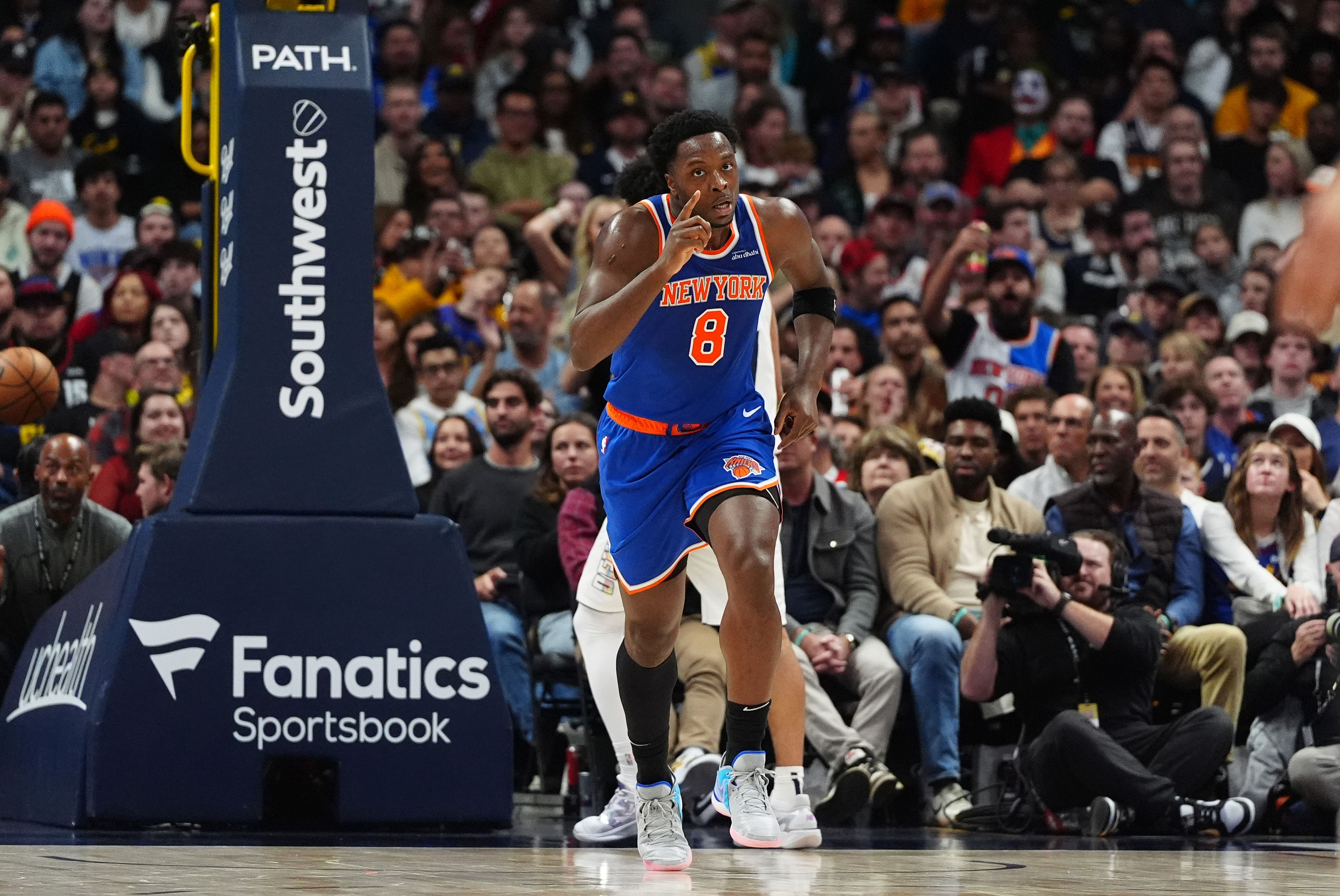 Nov 25, 2024; Denver, Colorado, USA; New York Knicks forward OG Anunoby (8) celebrates a breakaway score in the second quarter against the Denver Nuggets at Ball Arena. Mandatory Credit: Ron Chenoy-Imagn Images - Source: Imagn