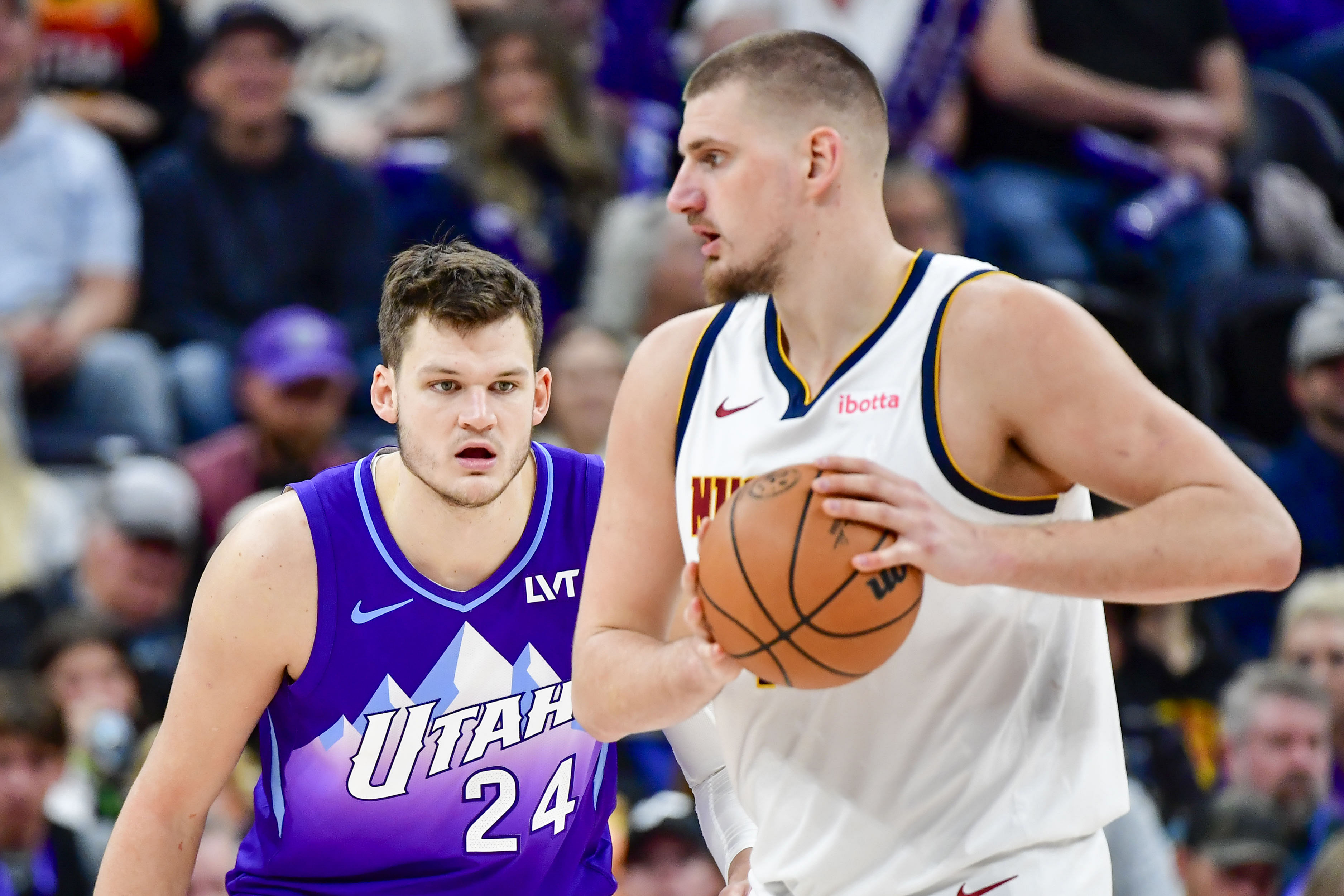 Utah Jazz center Walker Kessler defends Denver Nuggets center Nikola Jokic at the Delta Center. Photo Credit: Imagn