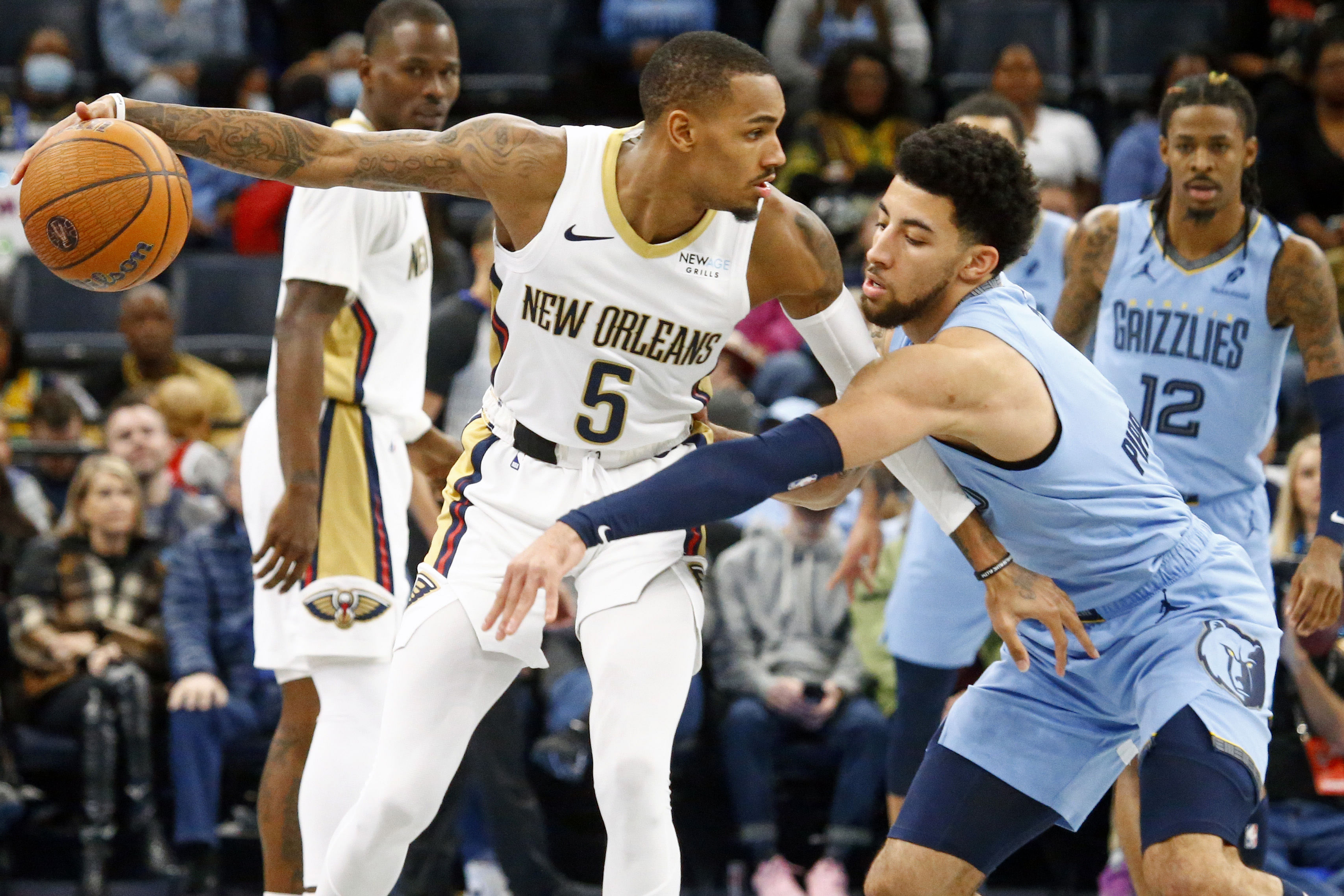 New Orleans Pelicans guard Dejounte Murray dribbles as Memphis Grizzlies guard Scotty Pippen Jr. defends at FedExForum. Photo Credit: Imagn