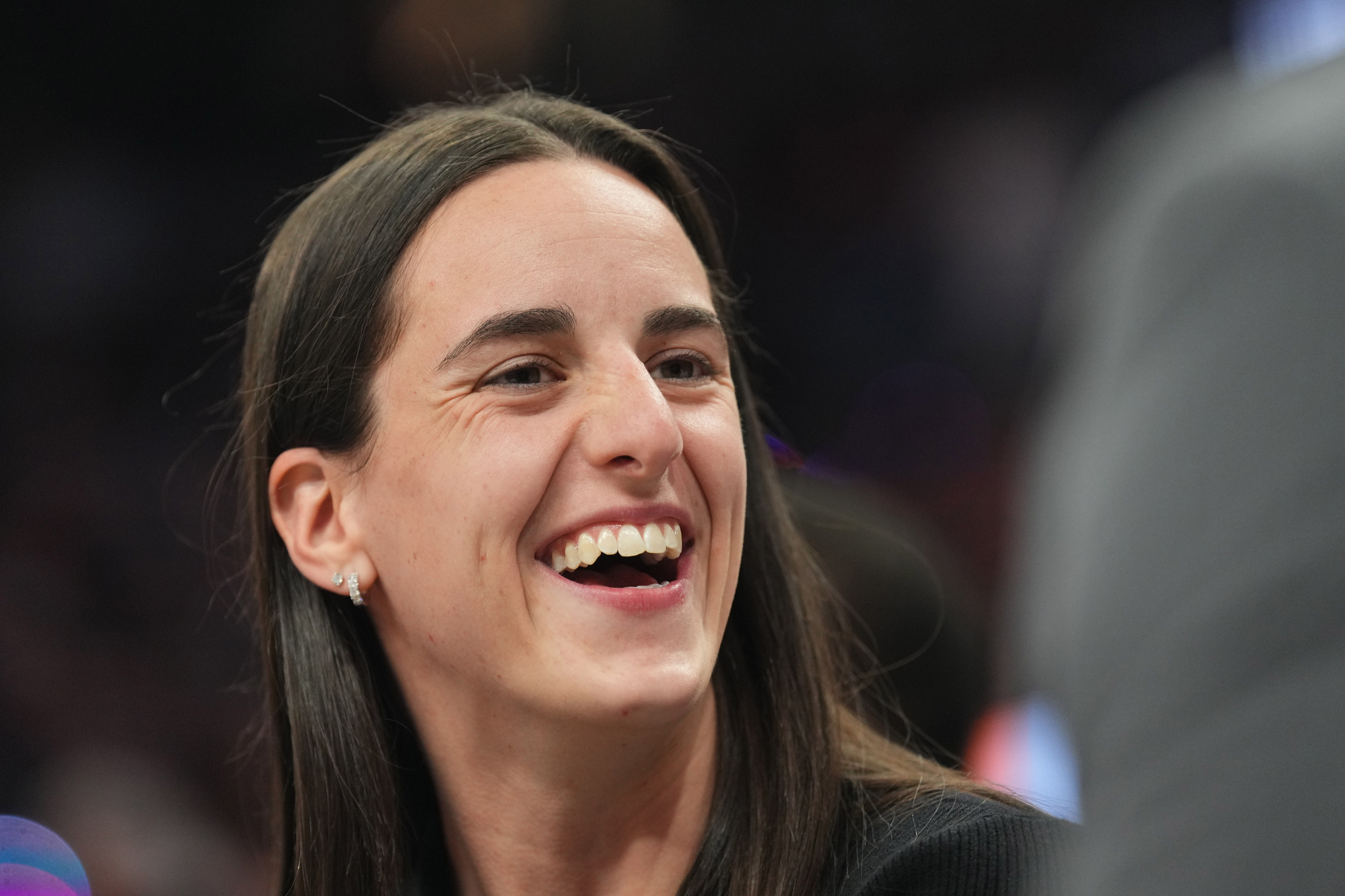 Nov 30, 2024; Phoenix, Arizona, USA; Indiana Fever player Caitlin Clark looks on during the second half of the game between the Phoenix Suns and the Golden State Warriors at Footprint Center. Mandatory Credit: Joe Camporeale-Imagn Images - Source: Imagn