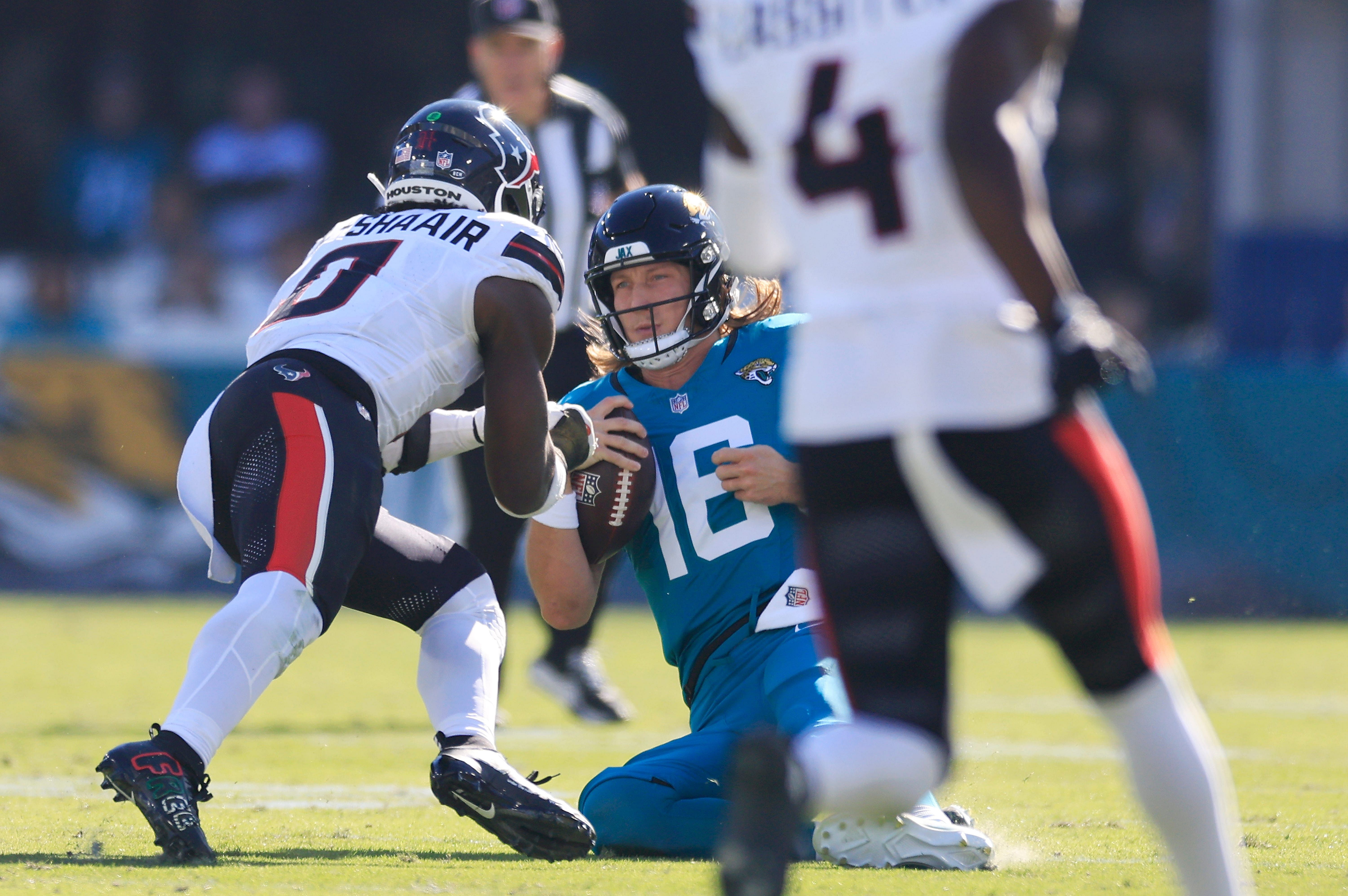 Texans LB Azeez Al-Shaair (L) hits Jaguars QB Trevor Lawrence late in Week 13 matchup- Source: Imagn