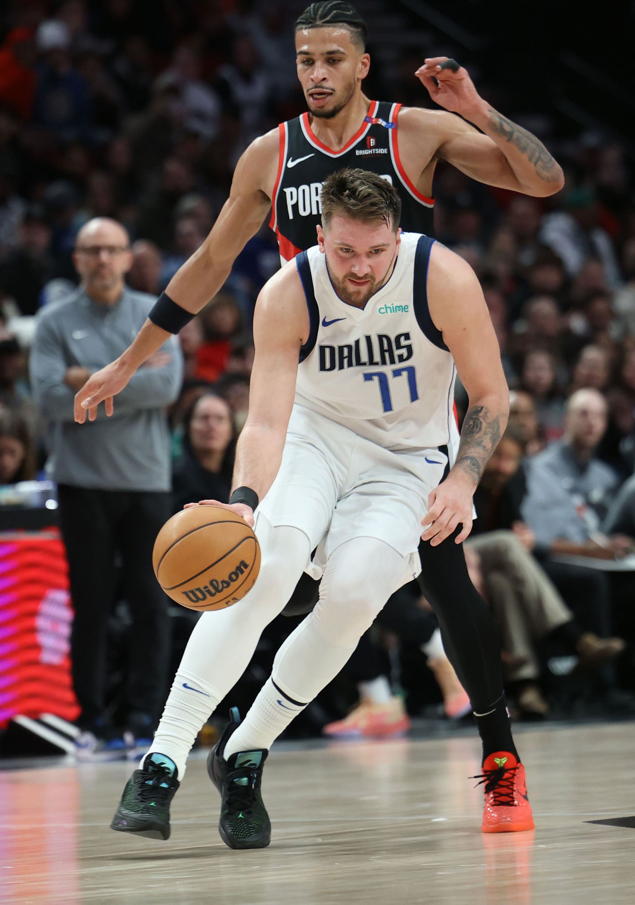 Dallas Mavericks guard Luka Doncic (77) dribbles the ball past Portland Trail Blazers forward Toumani Camara (33) on Sunday Night - Source: Imagn