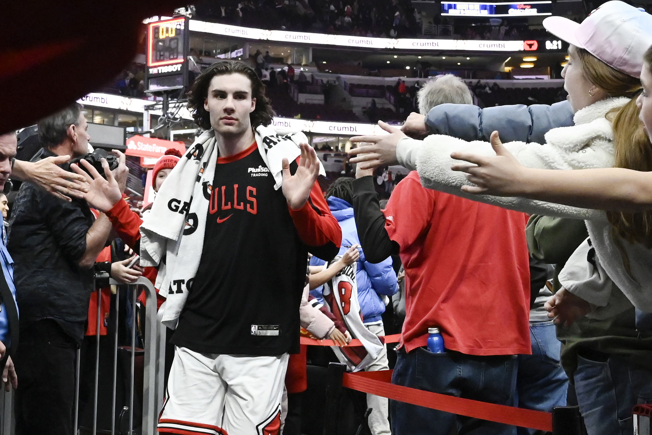 Dec 2, 2024; Chicago, Illinois, USA; Chicago Bulls guard Josh Giddey (3) greets fans after the second half against the Brooklyn Nets at the United Center. Mandatory Credit: Matt Marton-Imagn Images - Source: Imagn