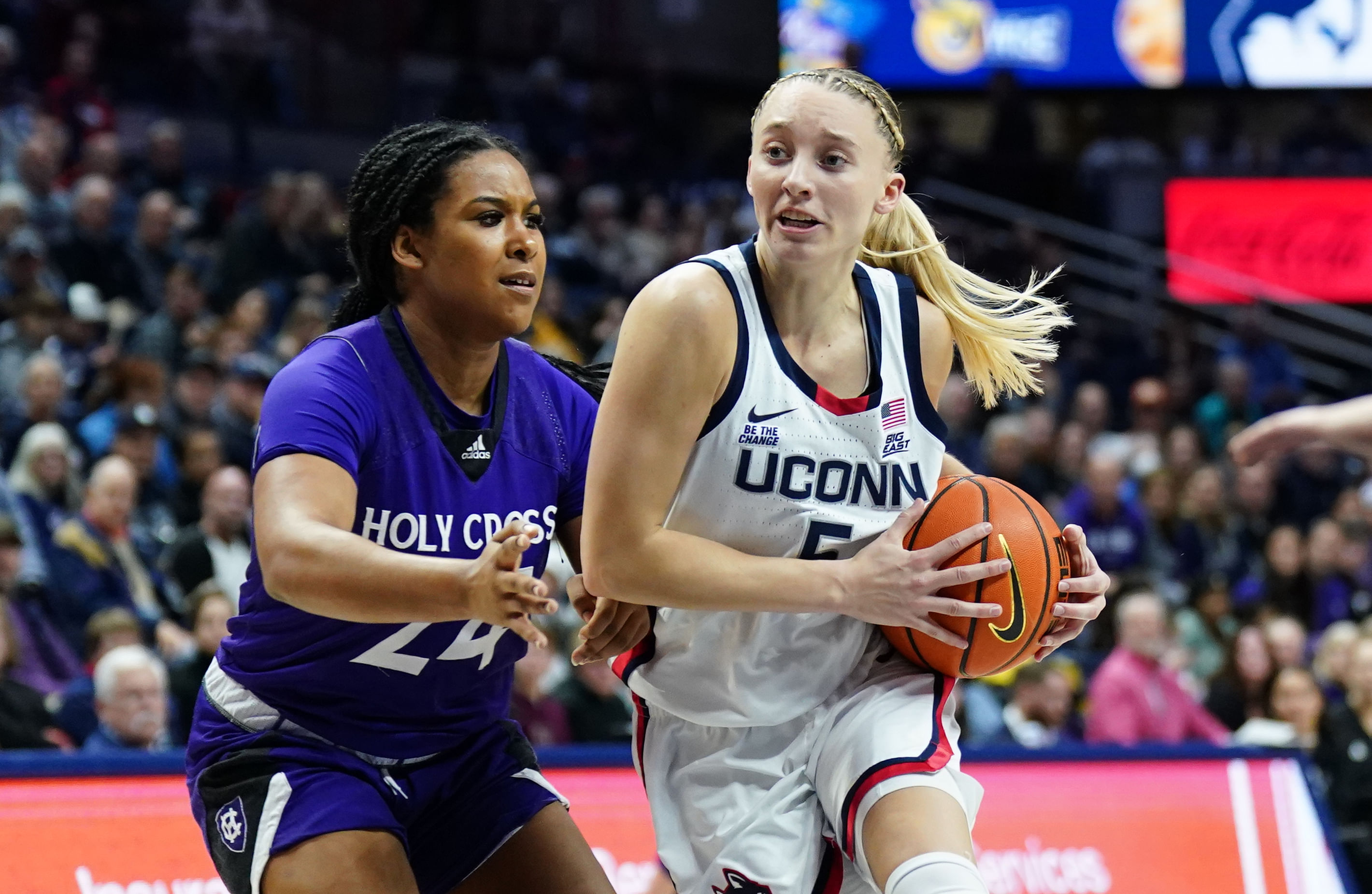 UConn Huskies guard Paige Bueckers (5) drives the ball against Holy Cross Crusaders guard Simone Foreman (24) in the second half of their NCAA game at Harry A. Gampel Pavilion. Photo: Imagn