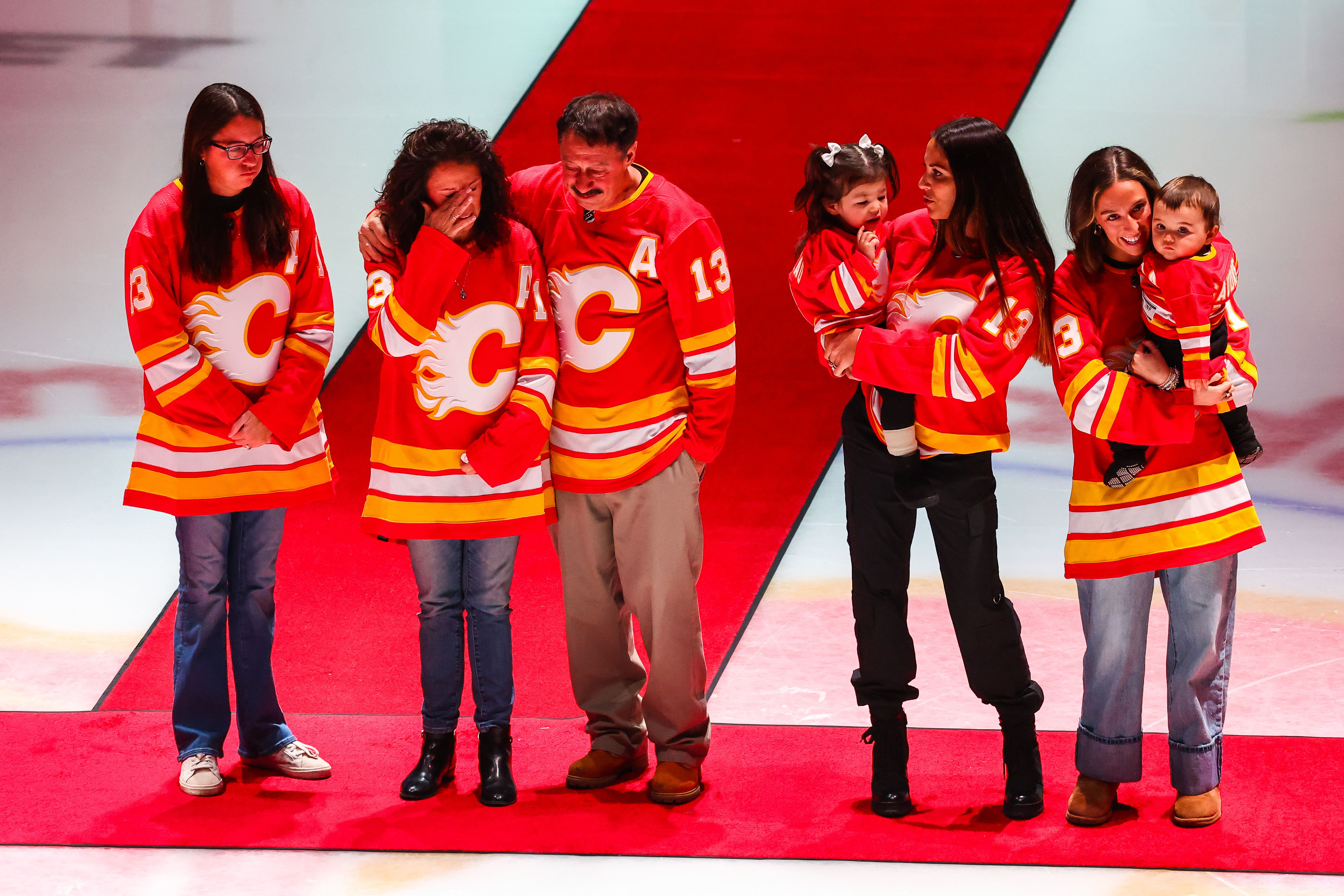 The Gaudreau family during ceremonial puck drop before the Flames vs. Blue Jackets game on Dec. 3. (Credits: IMAGN)